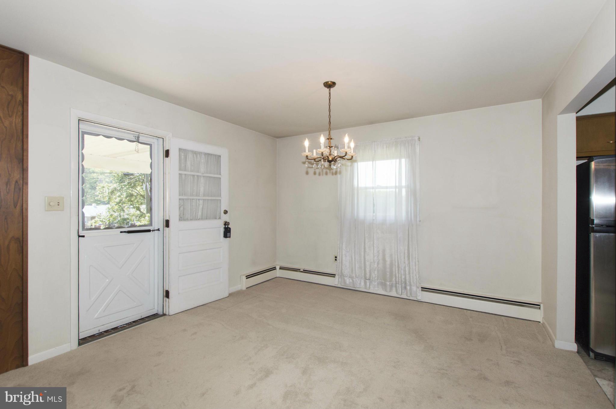 2903 Ashwood Road Fallston, MD 21047 - Photo 8 of 30 an empty room with chandelier fan and windows