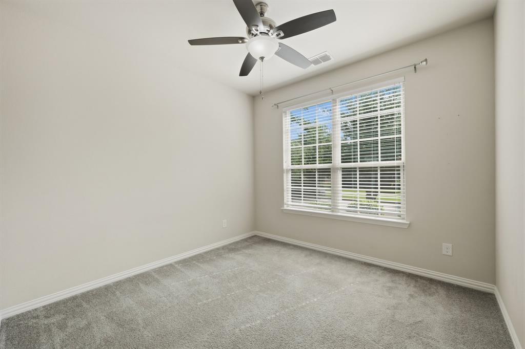 12809 Spring Hill Drive Frisco, TX 75035 - Photo 20 of 37 an empty room with a window and a fan