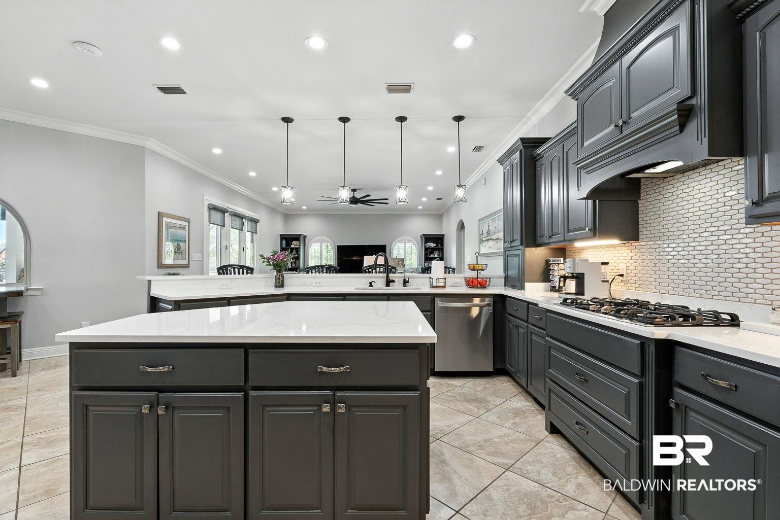 23357 Carnoustie Drive Foley, AL 36535 - Photo 37 of 99 Kitchen with backsplash, a center island, recessed lighting, crown molding, and stainless steel appliances