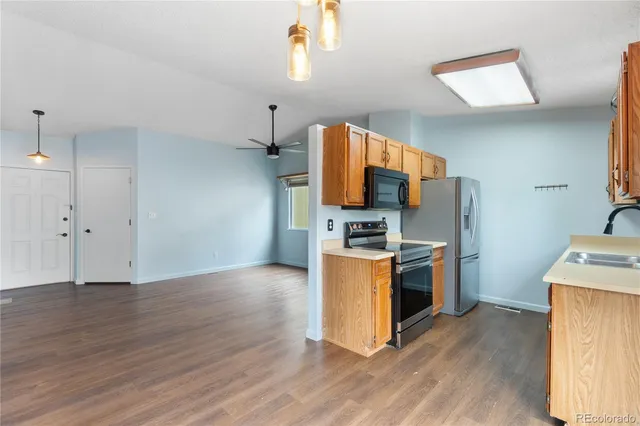 a view of kitchen with microwave and stove