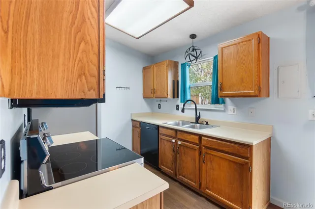 a kitchen with a sink and a stove