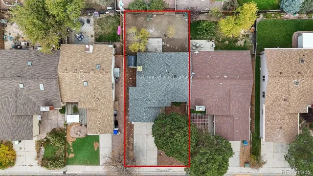 aerial view of a house with a yard and a fountain