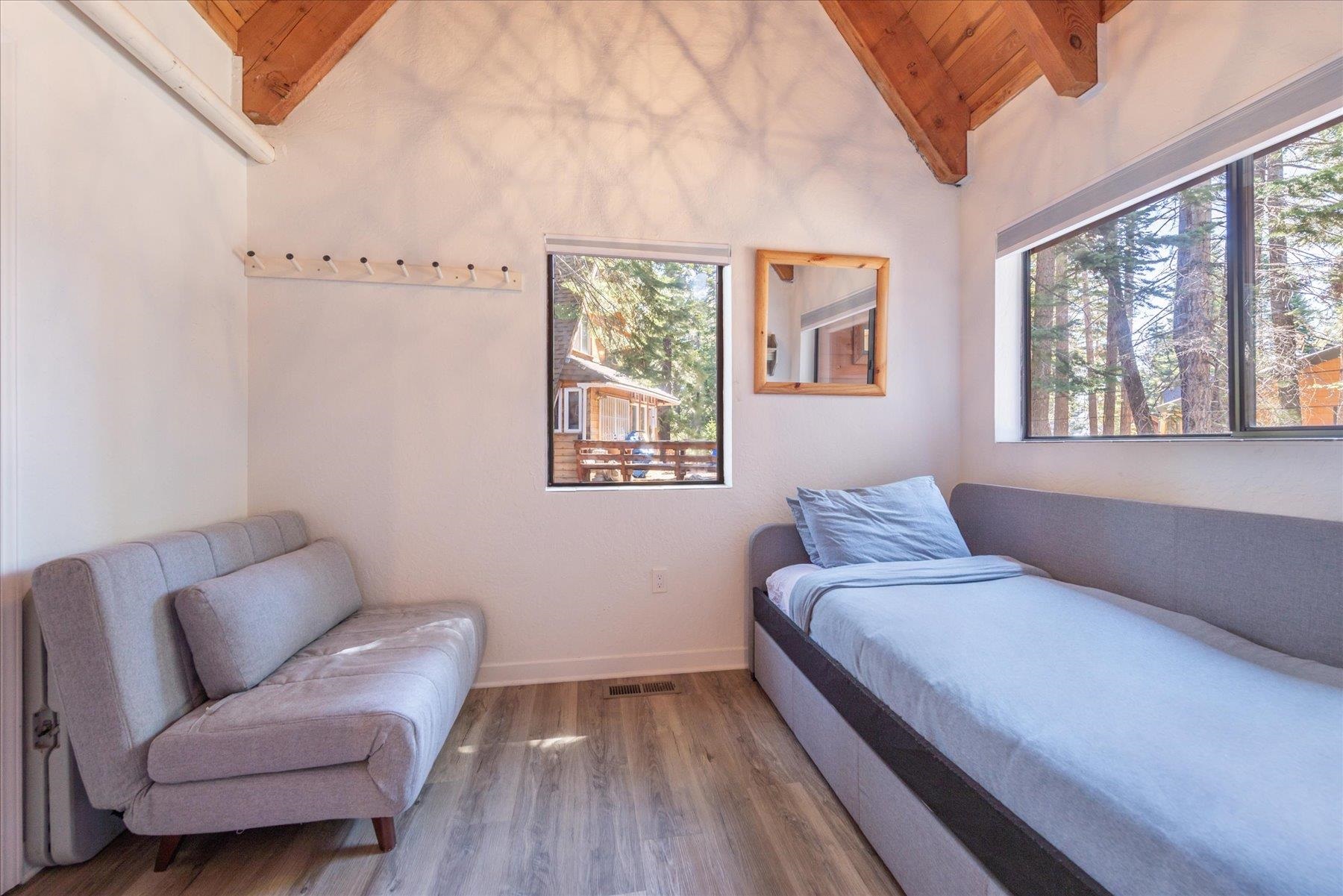 6255 Flicker Avenue Homewood, CA 96141 - Photo 12 of 22 a bedroom with a bed and a couch