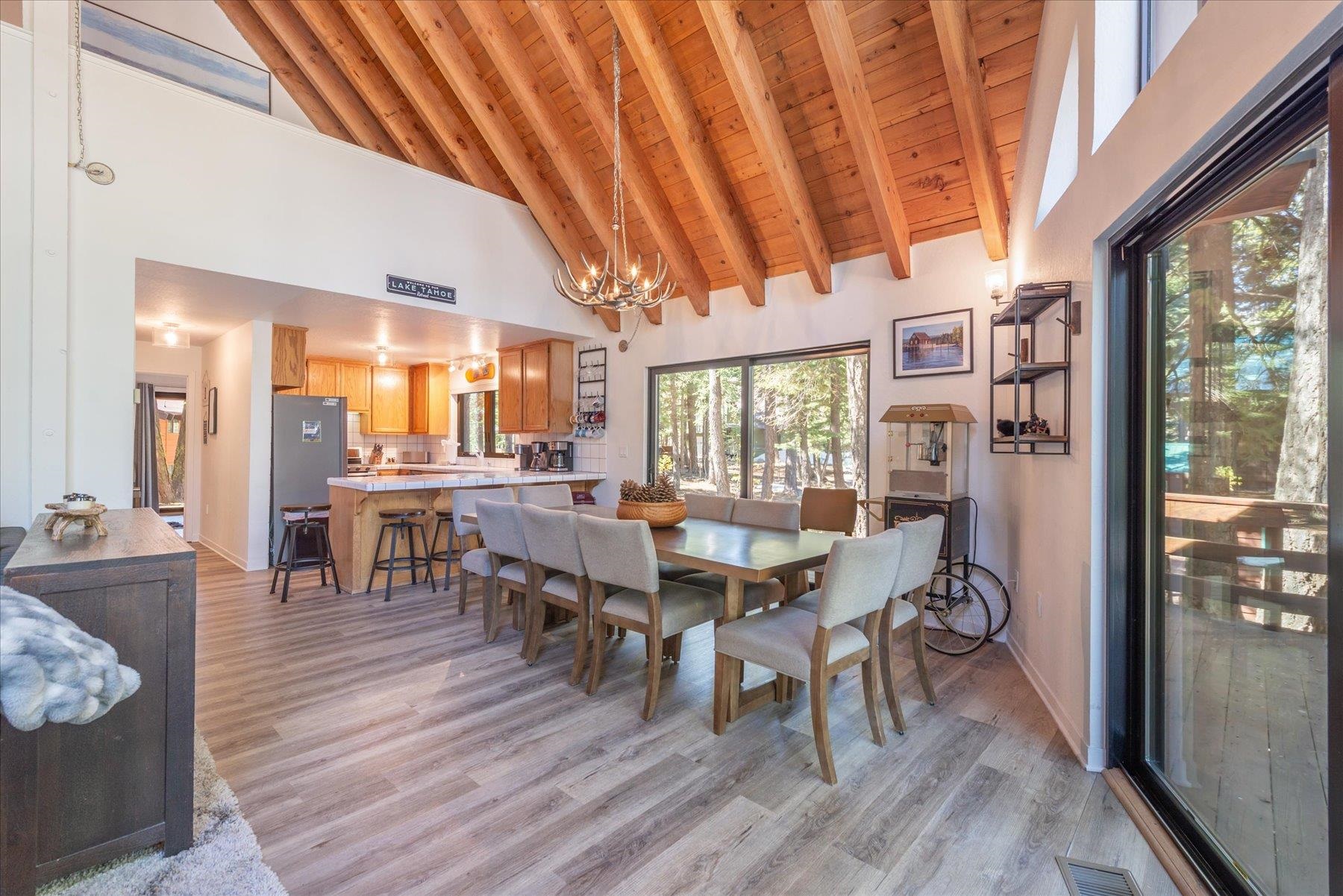 6255 Flicker Avenue Homewood, CA 96141 - Photo 6 of 22 a view of a dining room with furniture and wooden floor