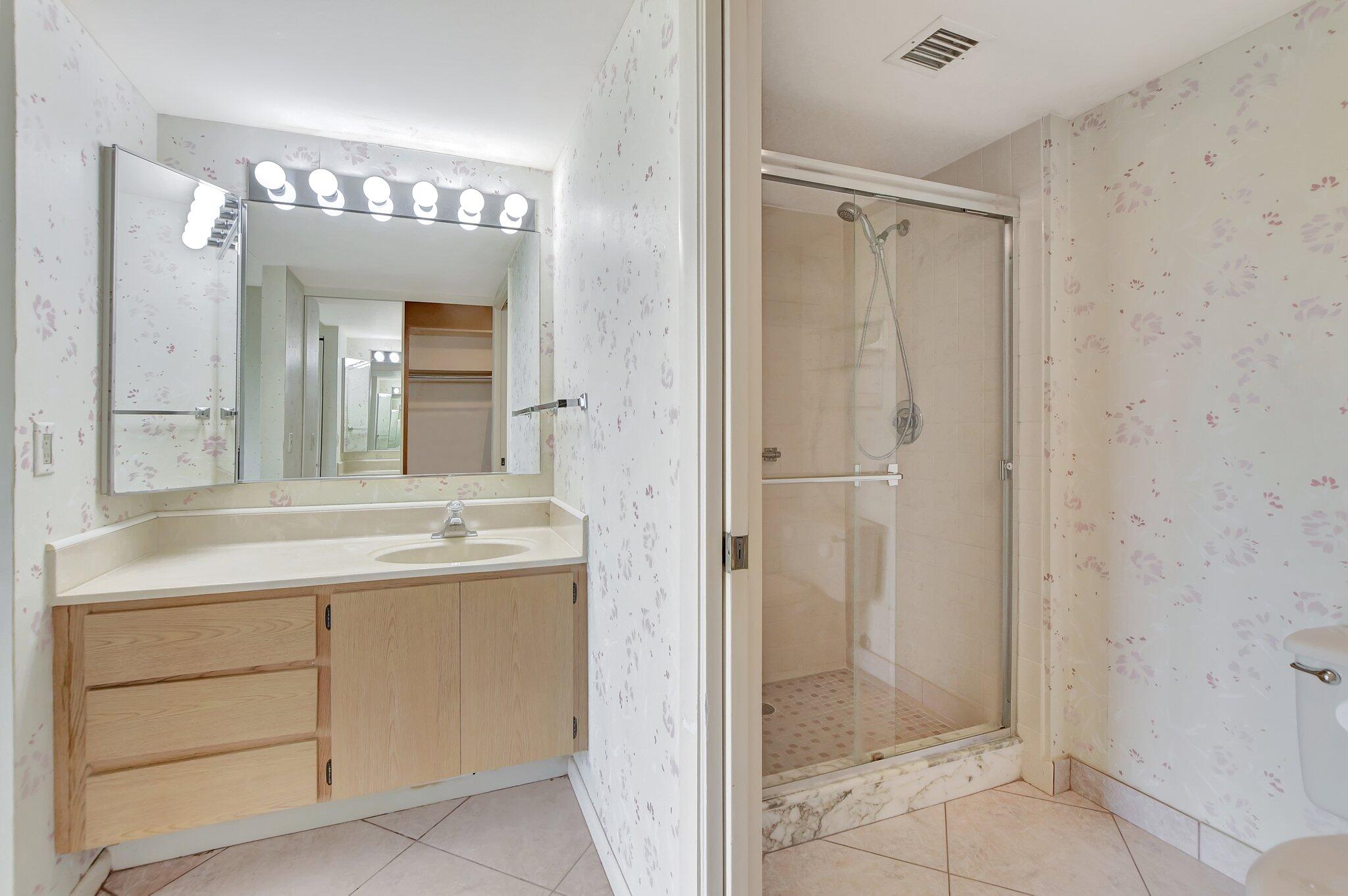 6145 Balboa Circle, Unit 405 Boca Raton, FL 33433 - Photo 18 of 25 Primary Suite Bath & Shower