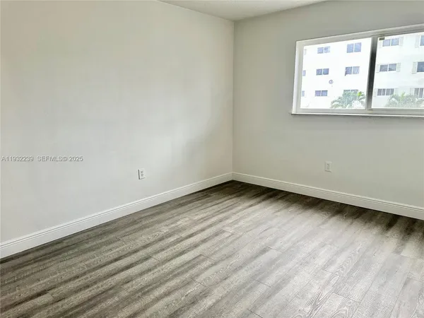 a view of a room that has a window in it