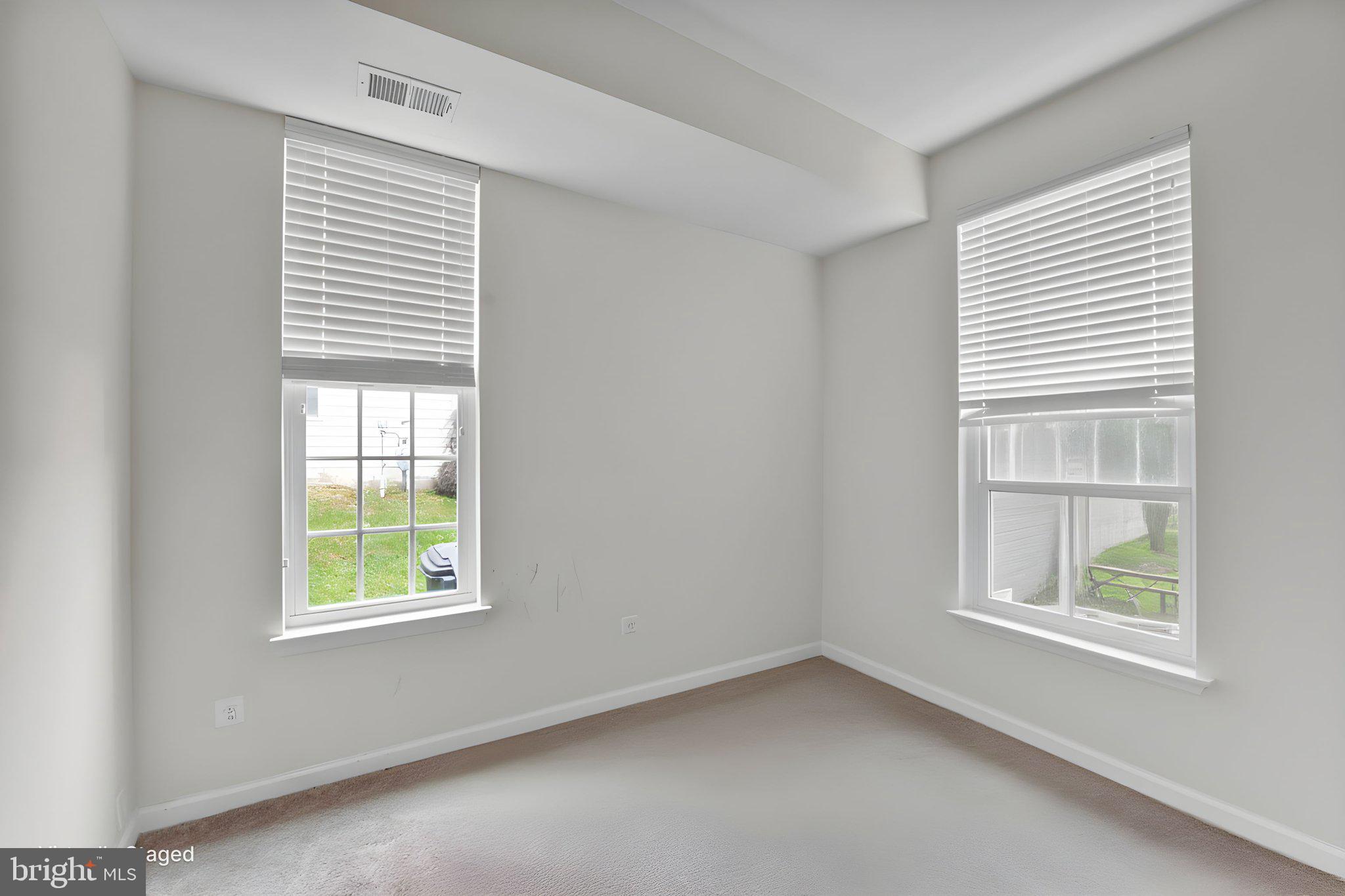 7138 Station House Road Elkridge, MD 21075 - Photo 38 of 42 an empty room with windows