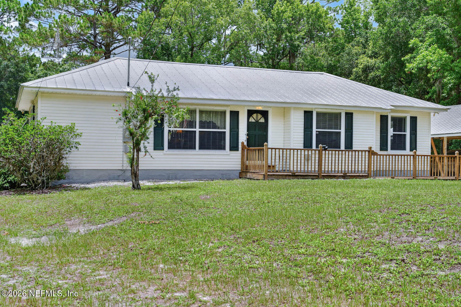 1950 Lightsey Road St. Augustine, FL 32084 - Photo 2 of 57 a front view of a house with a yard and garden