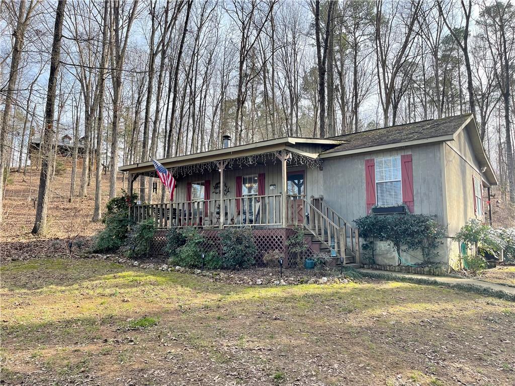 38 Wraymine Road Buchanan, GA 30113 - Photo 1 of 1 a front view of a house with a yard