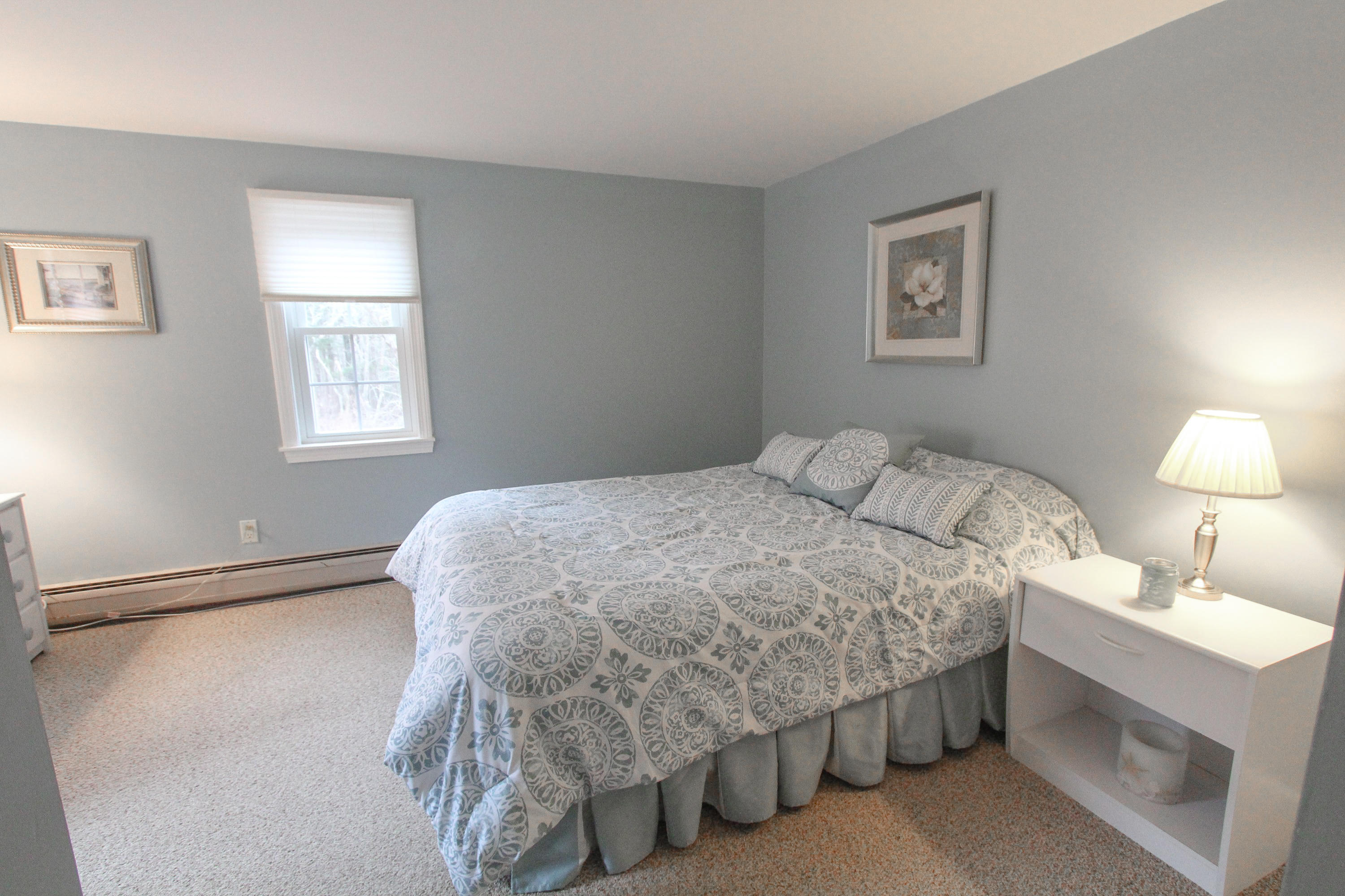 38 Putter Lane Hyannis, MA 02601 - Photo 20 of 30 a bedroom with a bed and a lamp
