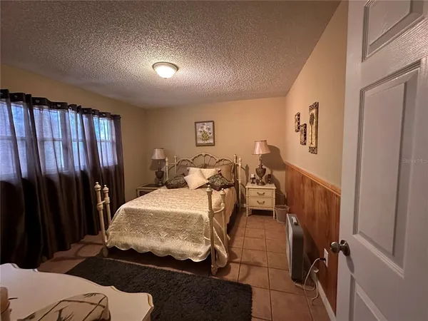 a bed room with a bed and furniture