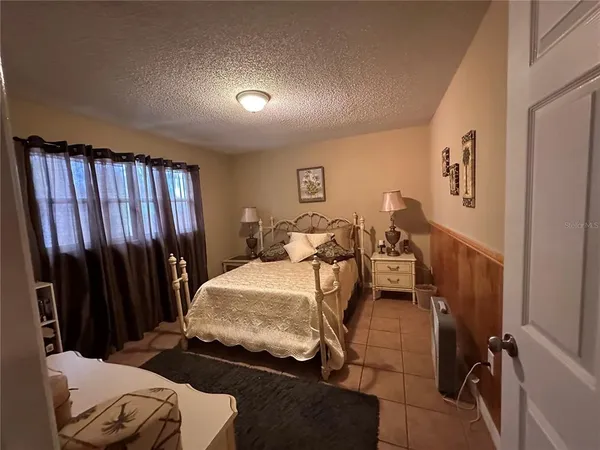 a bed room with a bed and furniture