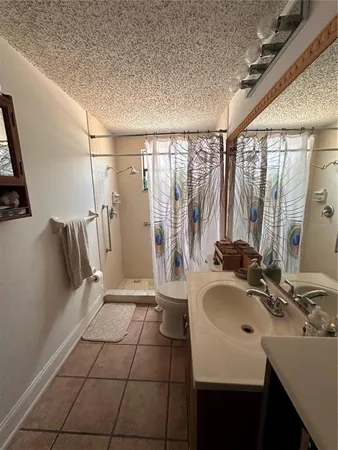 a bathroom with a sink a mirror and a bathtub