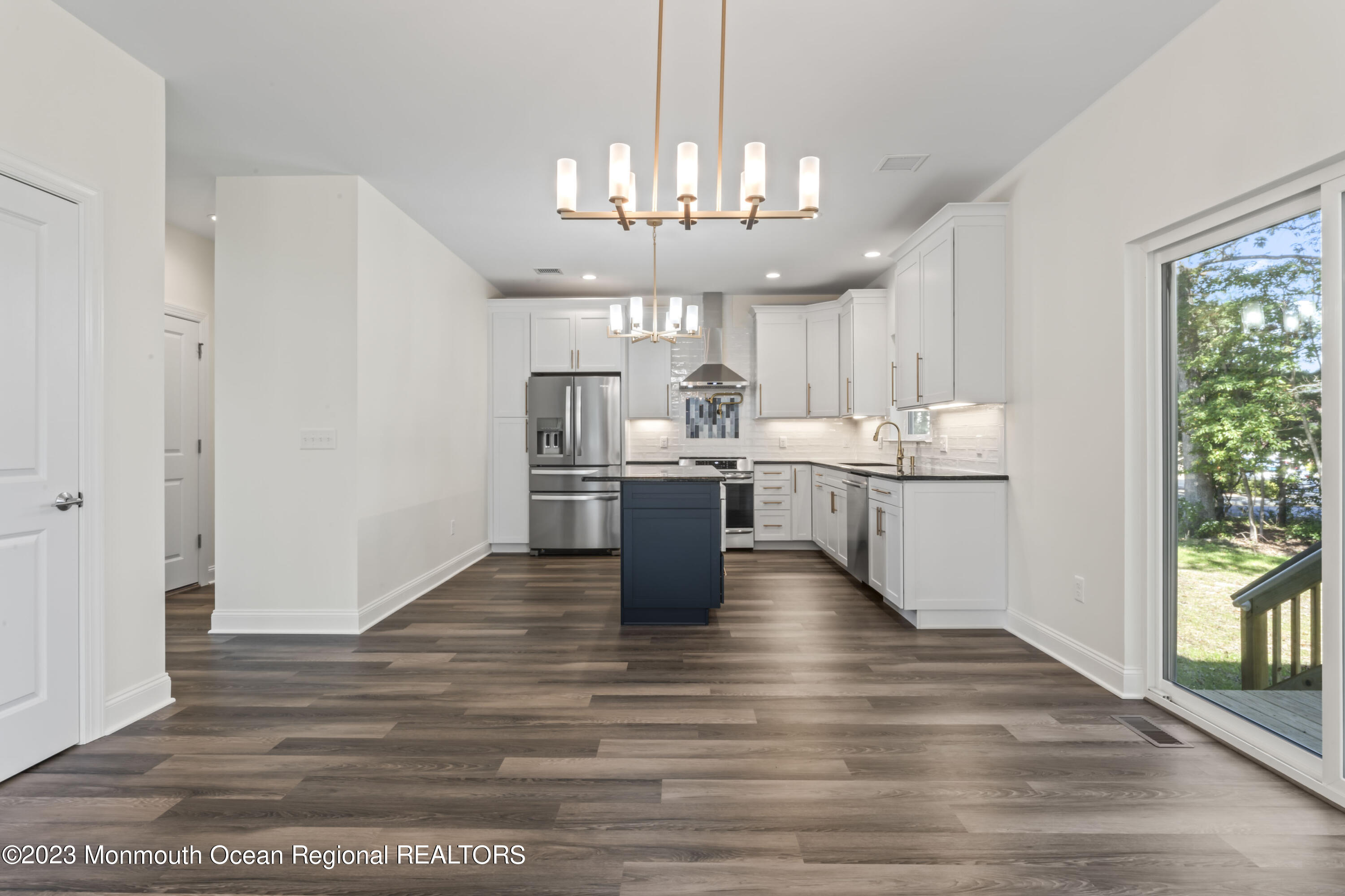 14 Patrick Court Toms River, NJ 08755 - Photo 11 of 30 a kitchen with stainless steel appliances granite countertop a sink cabinets and wooden floor