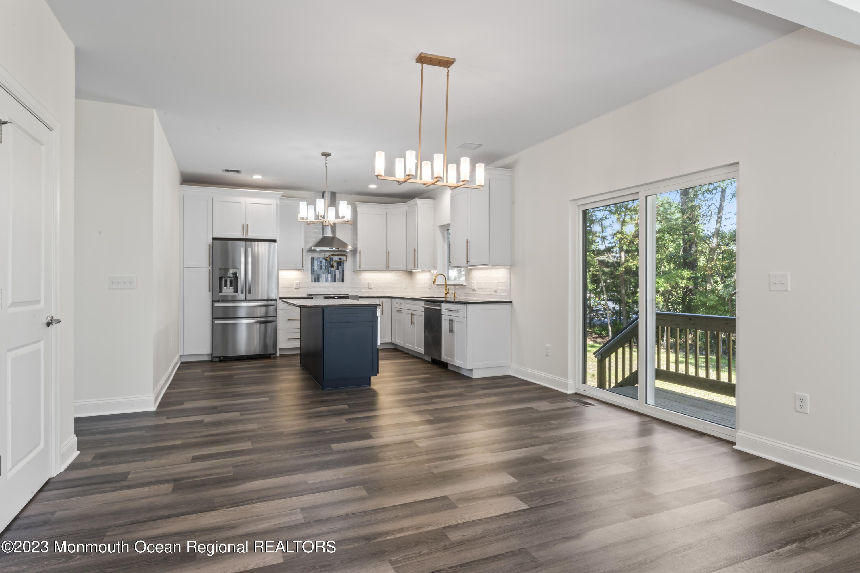 14 Patrick Court Toms River, NJ 08755 - Photo 13 of 30 a view of a kitchen with kitchen island a sink wooden floor and a large window