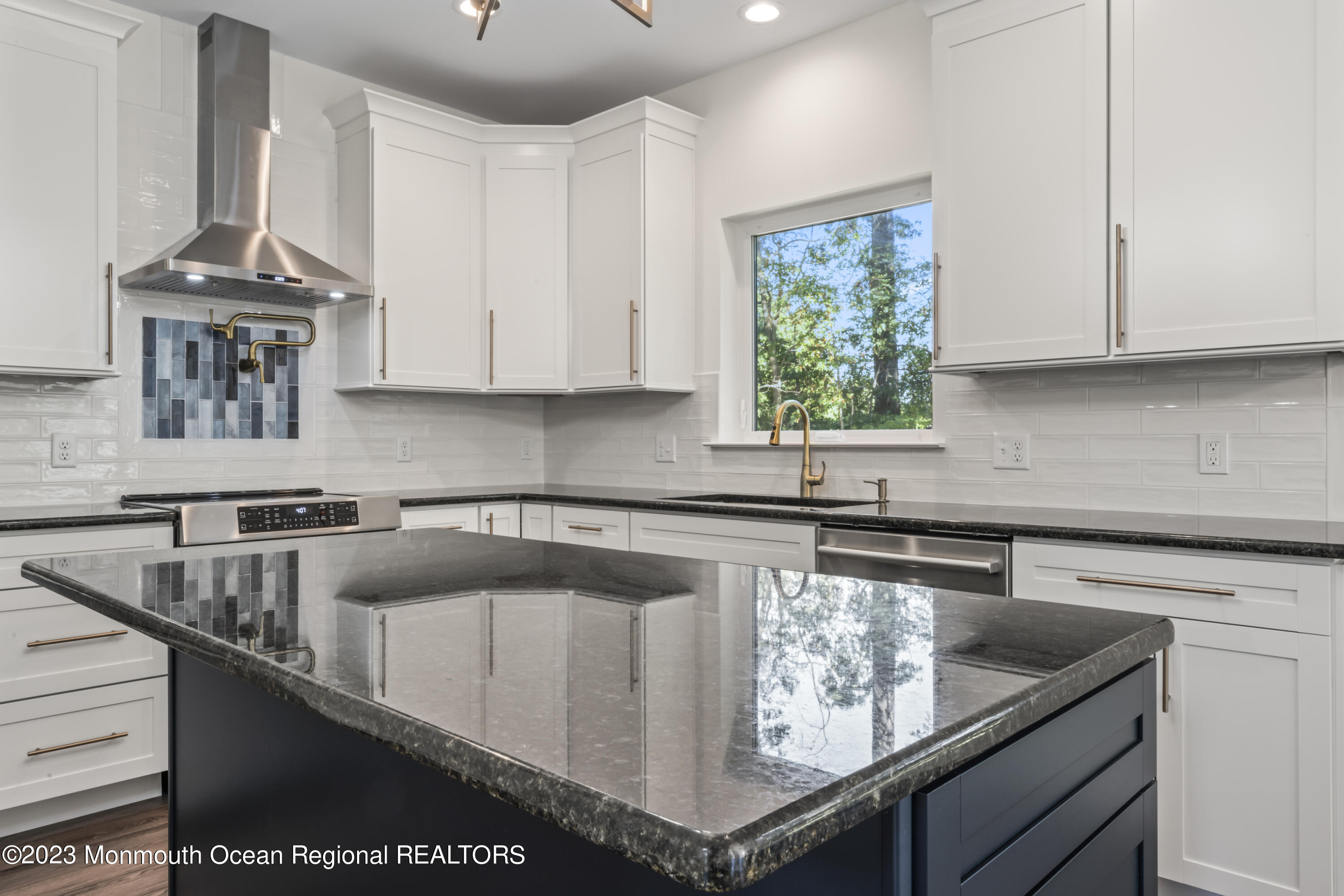 14 Patrick Court Toms River, NJ 08755 - Photo 15 of 30 a kitchen with granite countertop a sink a stove and cabinets