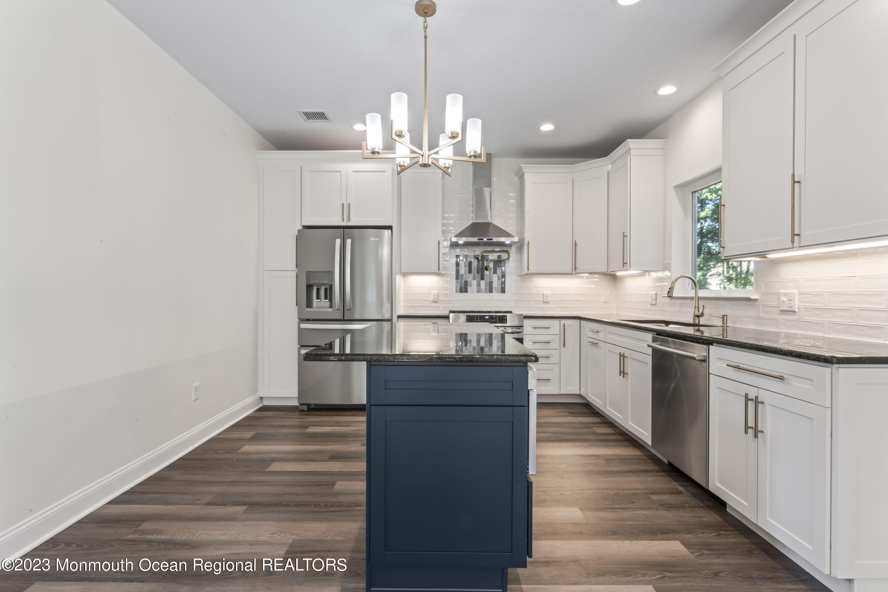 14 Patrick Court Toms River, NJ 08755 - Photo 16 of 30 a kitchen with kitchen island granite countertop a sink appliances cabinets and a counter top space