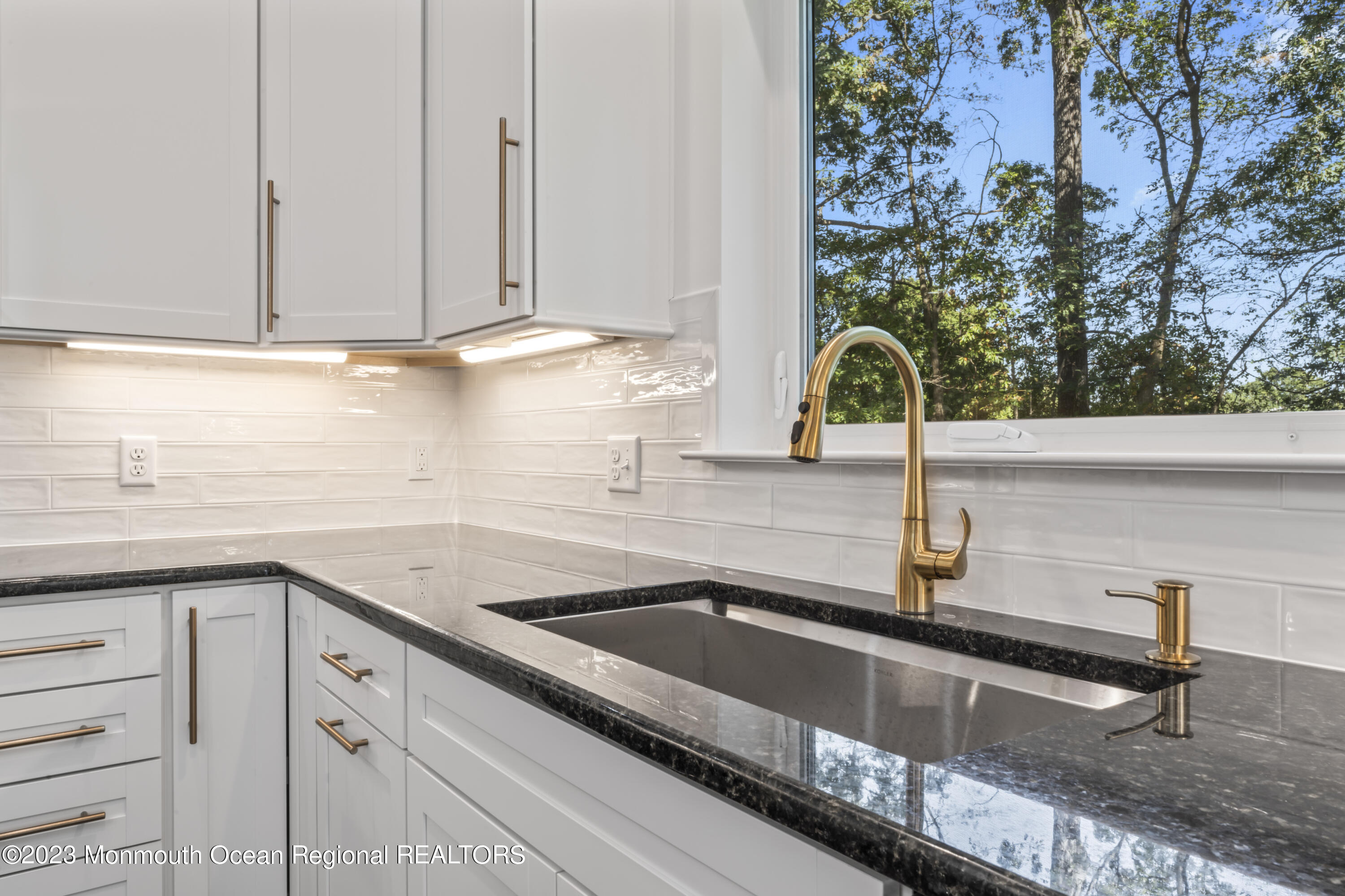 14 Patrick Court Toms River, NJ 08755 - Photo 17 of 30 a kitchen with granite countertop a sink and a stove