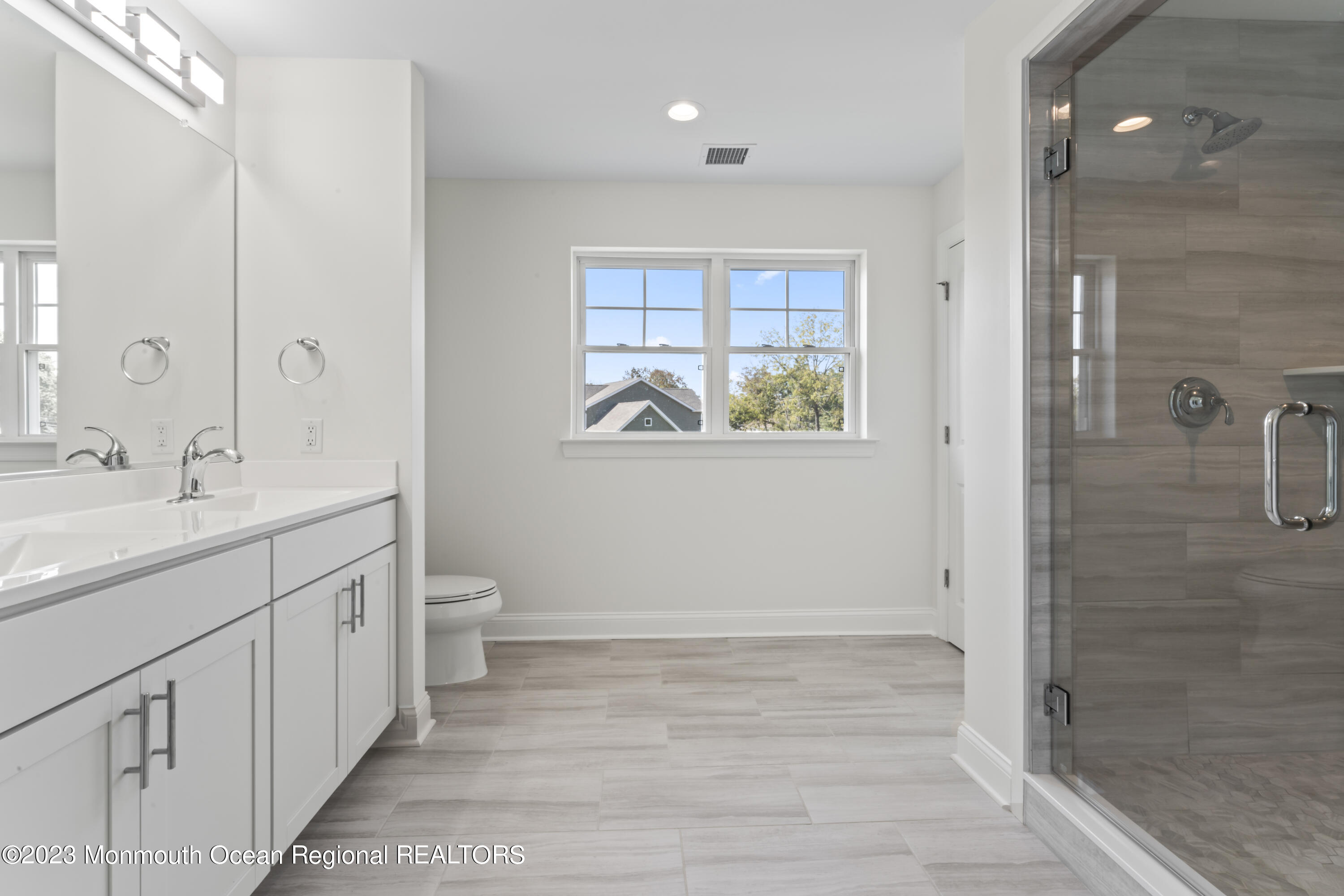14 Patrick Court Toms River, NJ 08755 - Photo 24 of 30 a spacious bathroom with a double vanity sink a toilet and a shower