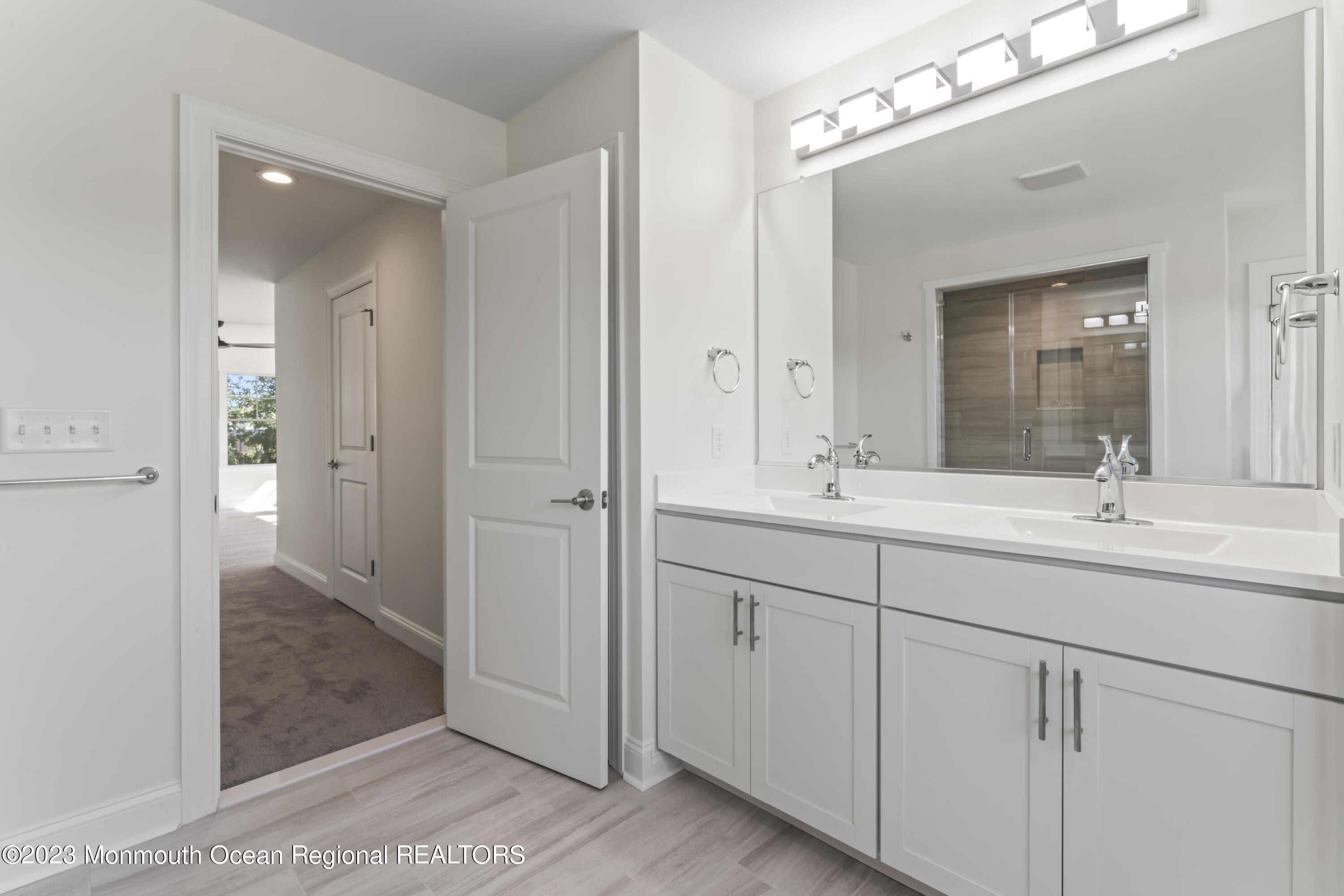 14 Patrick Court Toms River, NJ 08755 - Photo 26 of 30 a bathroom with double vanity sinks and a mirror