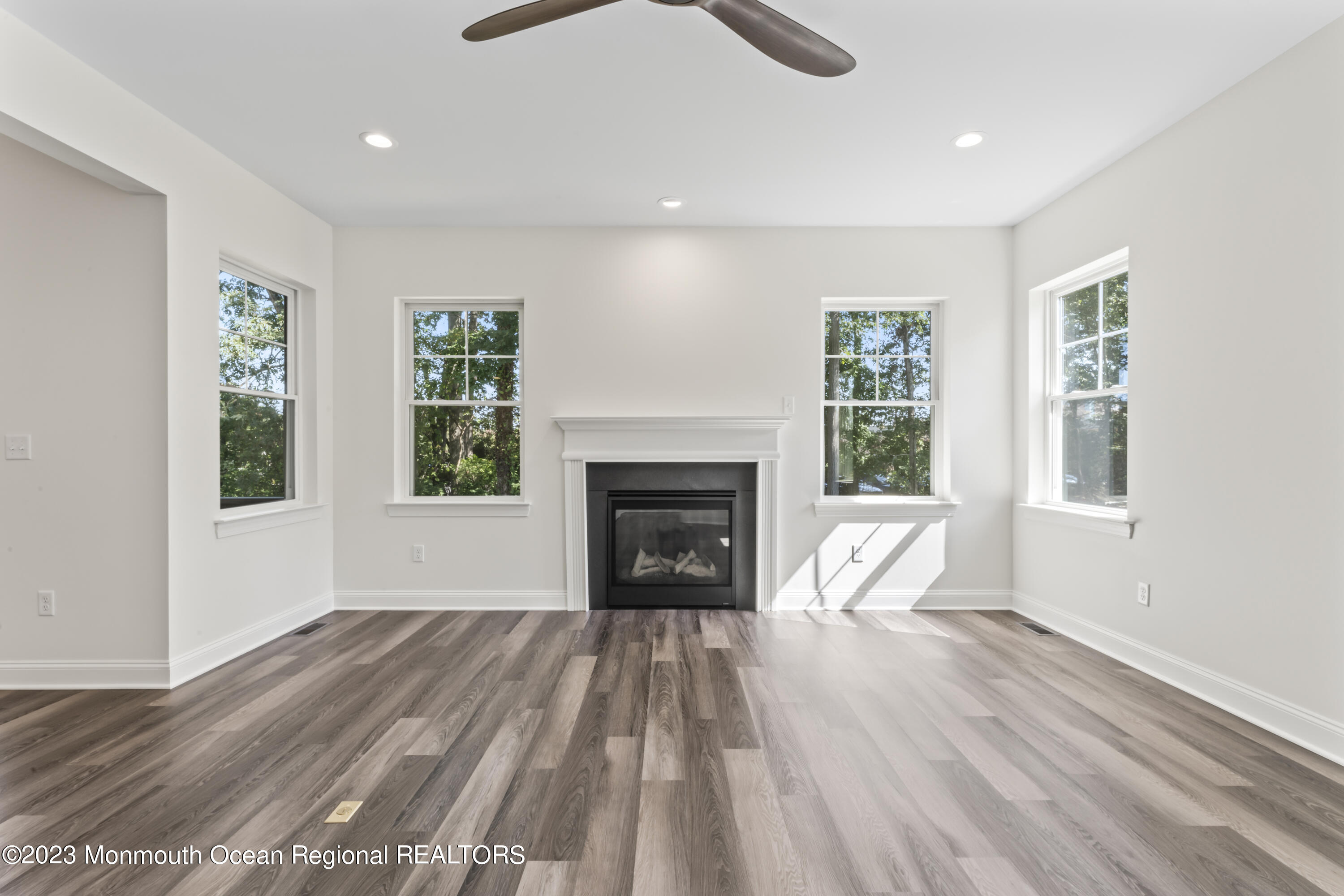 14 Patrick Court Toms River, NJ 08755 - Photo 6 of 30 a view of an empty room with wooden floor fireplace and a window