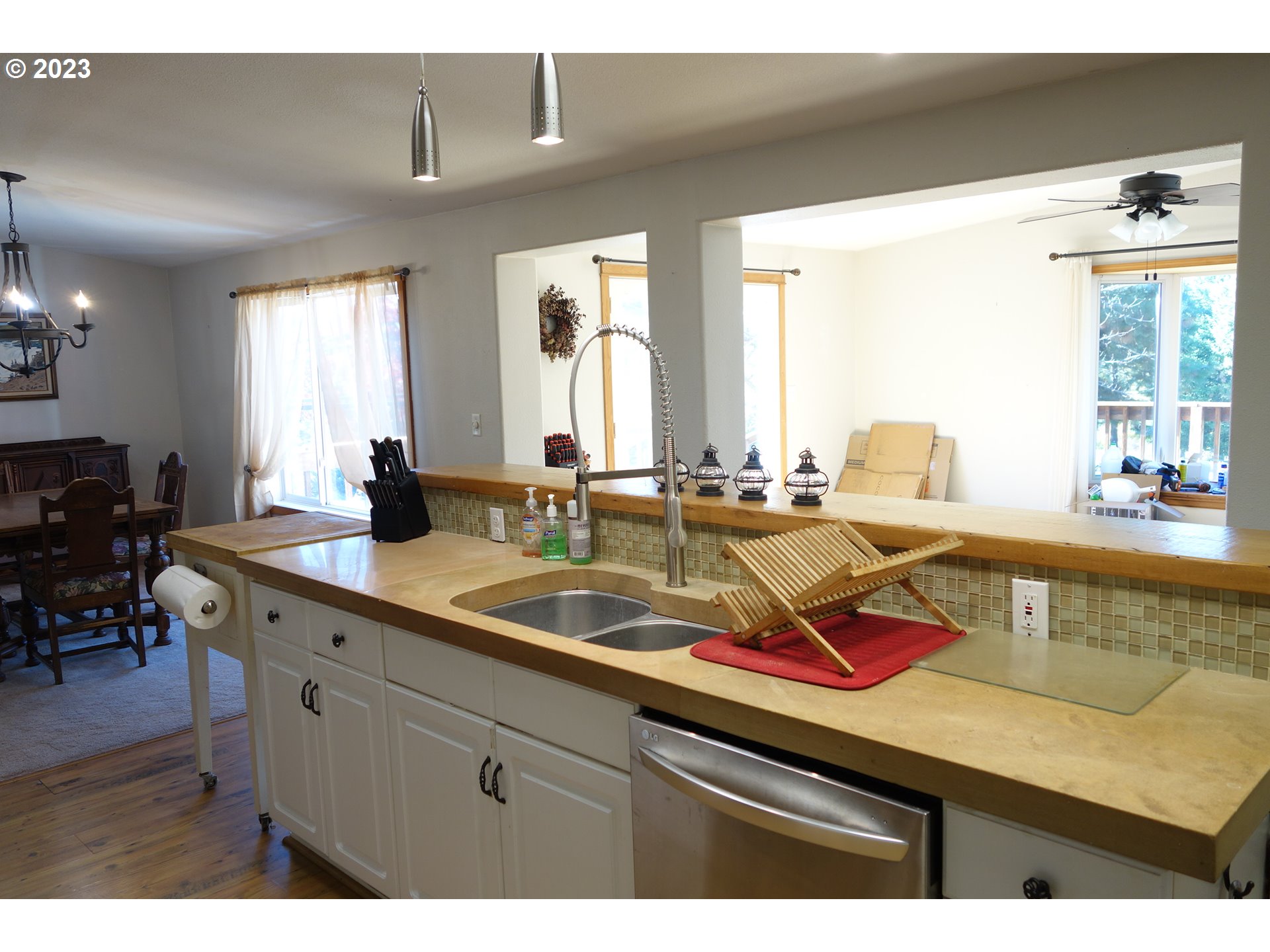 182 Bates Road White Salmon, WA 98672 - Photo 12 of 38 a kitchen with a sink a counter space and living room