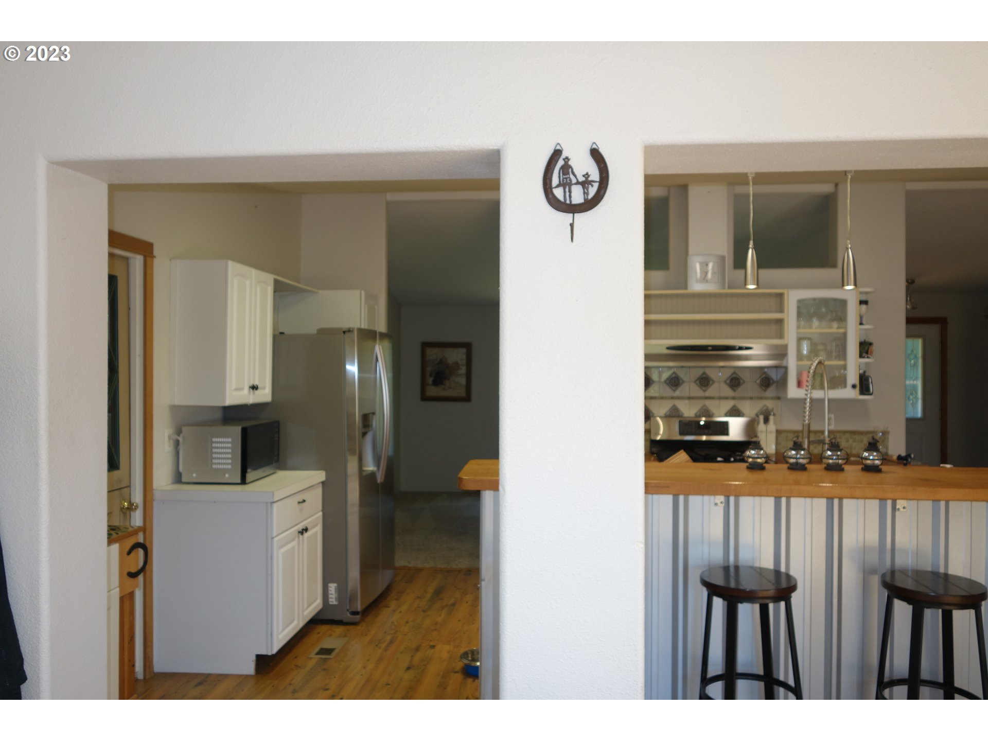 182 Bates Road White Salmon, WA 98672 - Photo 8 of 38 a kitchen view with granite countertop a sink and cabinets