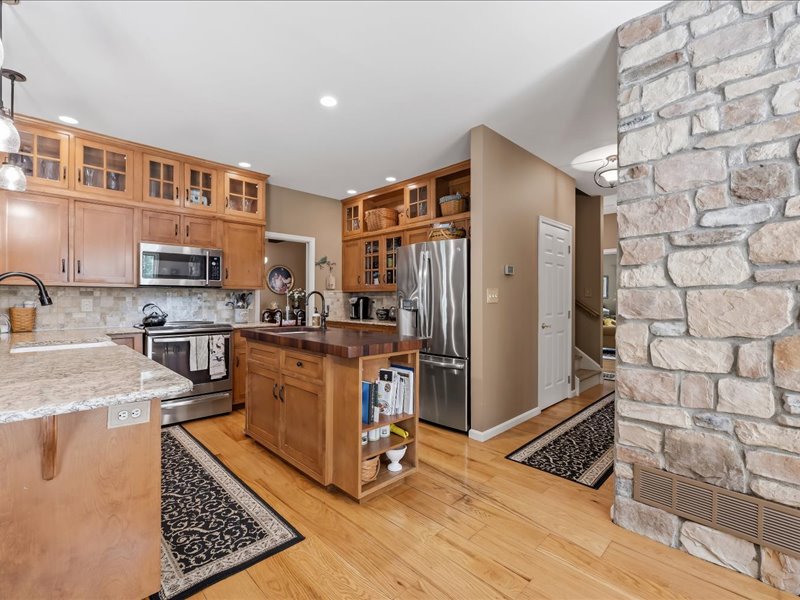 1168 Mt Pleasant Road Bangor, PA 18013 - Photo 35 of 100 Rich hardwood flooring complements custom cabinetry and an impressive stone accent pillar.