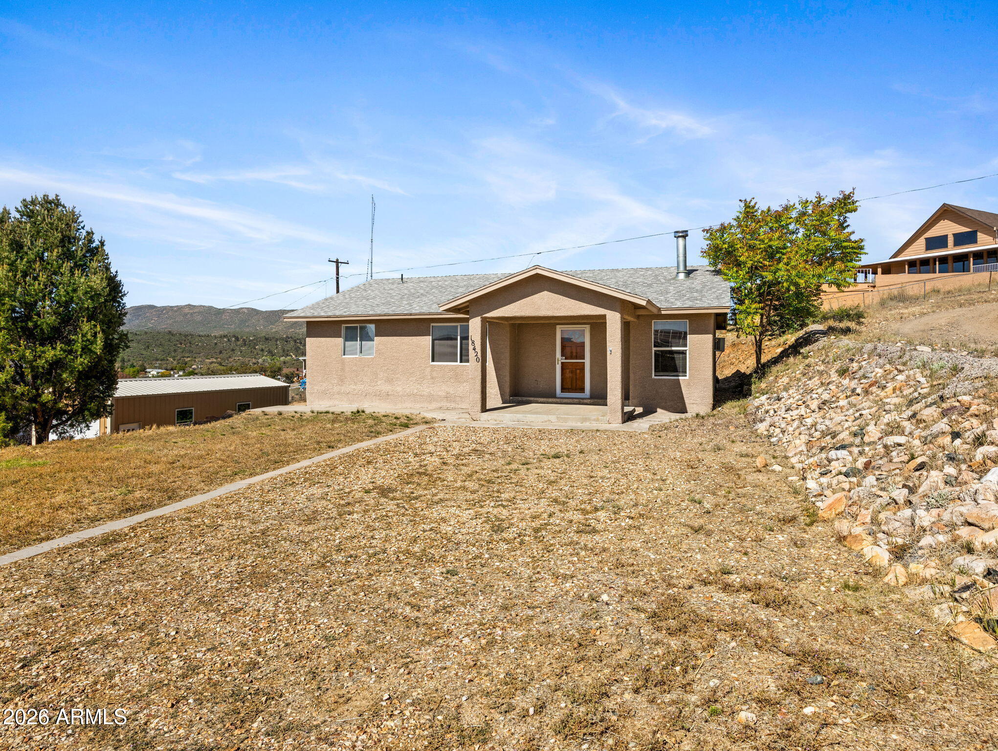 18420 Peeples Valley Road Peeples Valley, AZ 86332 - Photo 30 of 31 a front view of a house with a yard