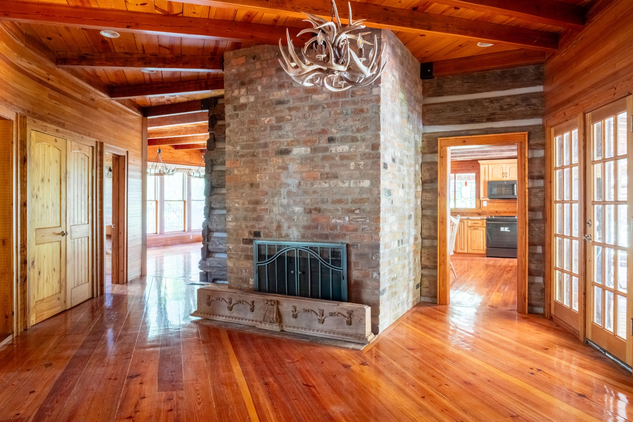 4340 Holland Chattoogaville Road Lyerly, GA 30730 - Photo 21 of 47 a view of a hallway with wooden floor and a fireplace