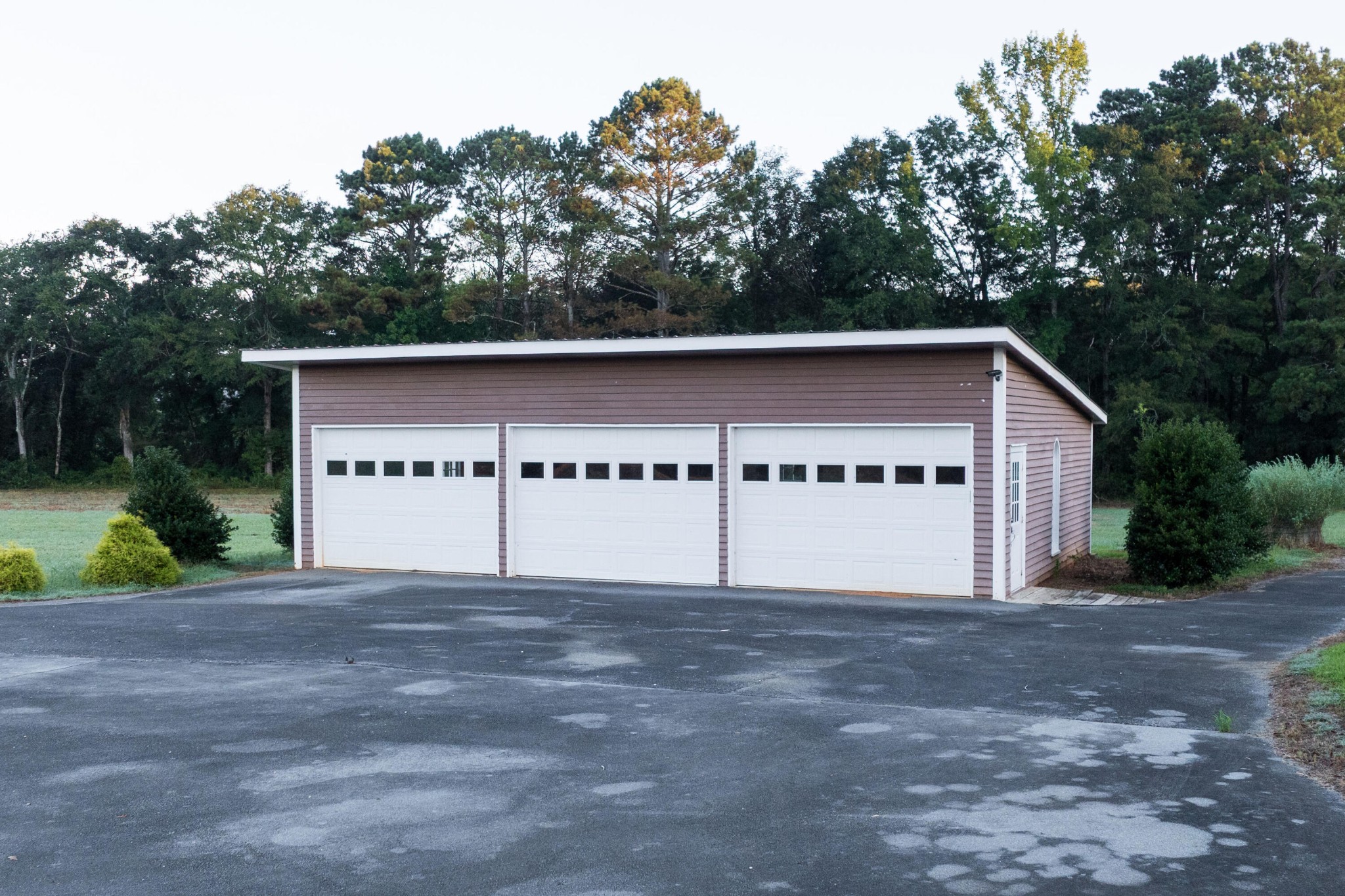 4340 Holland Chattoogaville Road Lyerly, GA 30730 - Photo 37 of 47 a front view of a house with a yard and garage