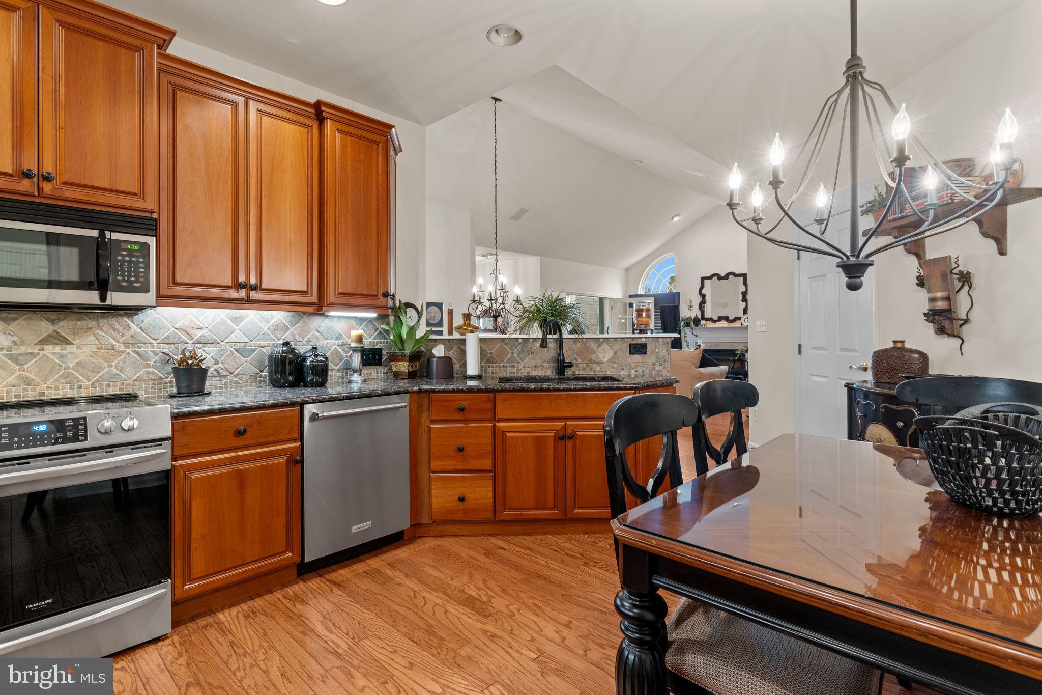 613 Bellflower Road Langhorne, PA 19047 - Photo 11 of 28 a kitchen with stainless steel appliances granite countertop a sink dishwasher stove and refrigerator