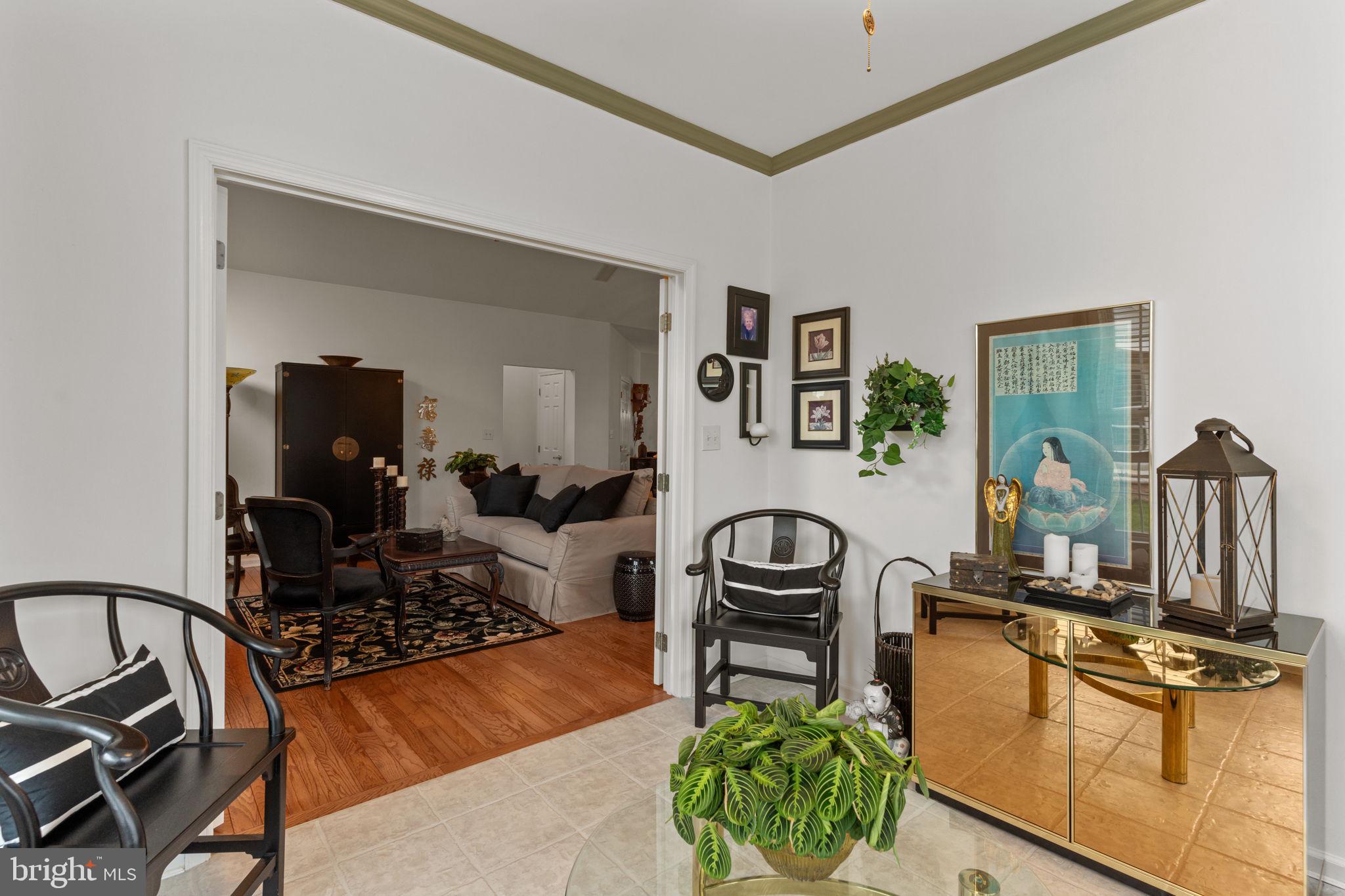 613 Bellflower Road Langhorne, PA 19047 - Photo 16 of 28 a living room with furniture a rug and a flat screen tv