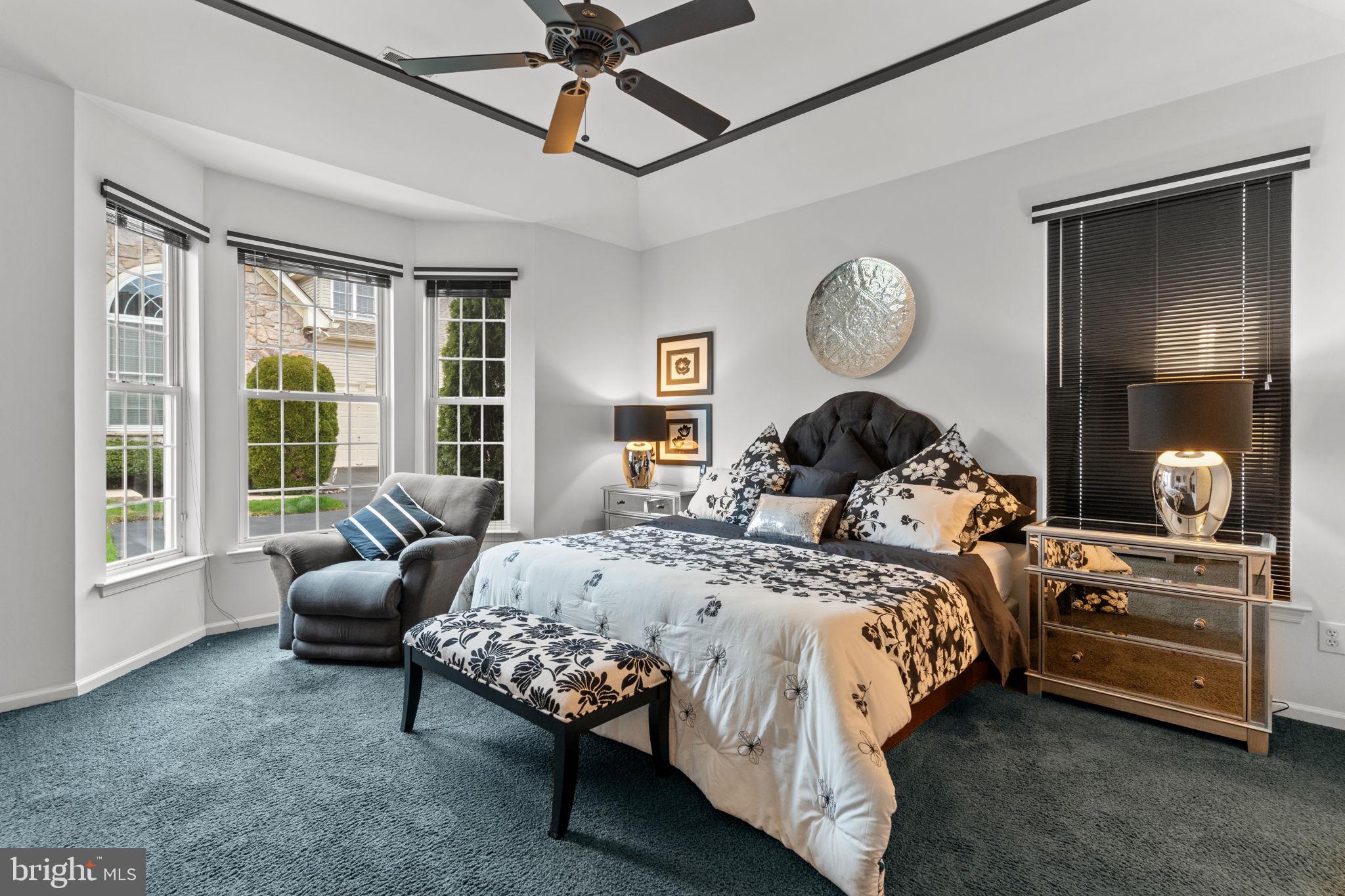 613 Bellflower Road Langhorne, PA 19047 - Photo 17 of 28 a bedroom with a bed mirror and window