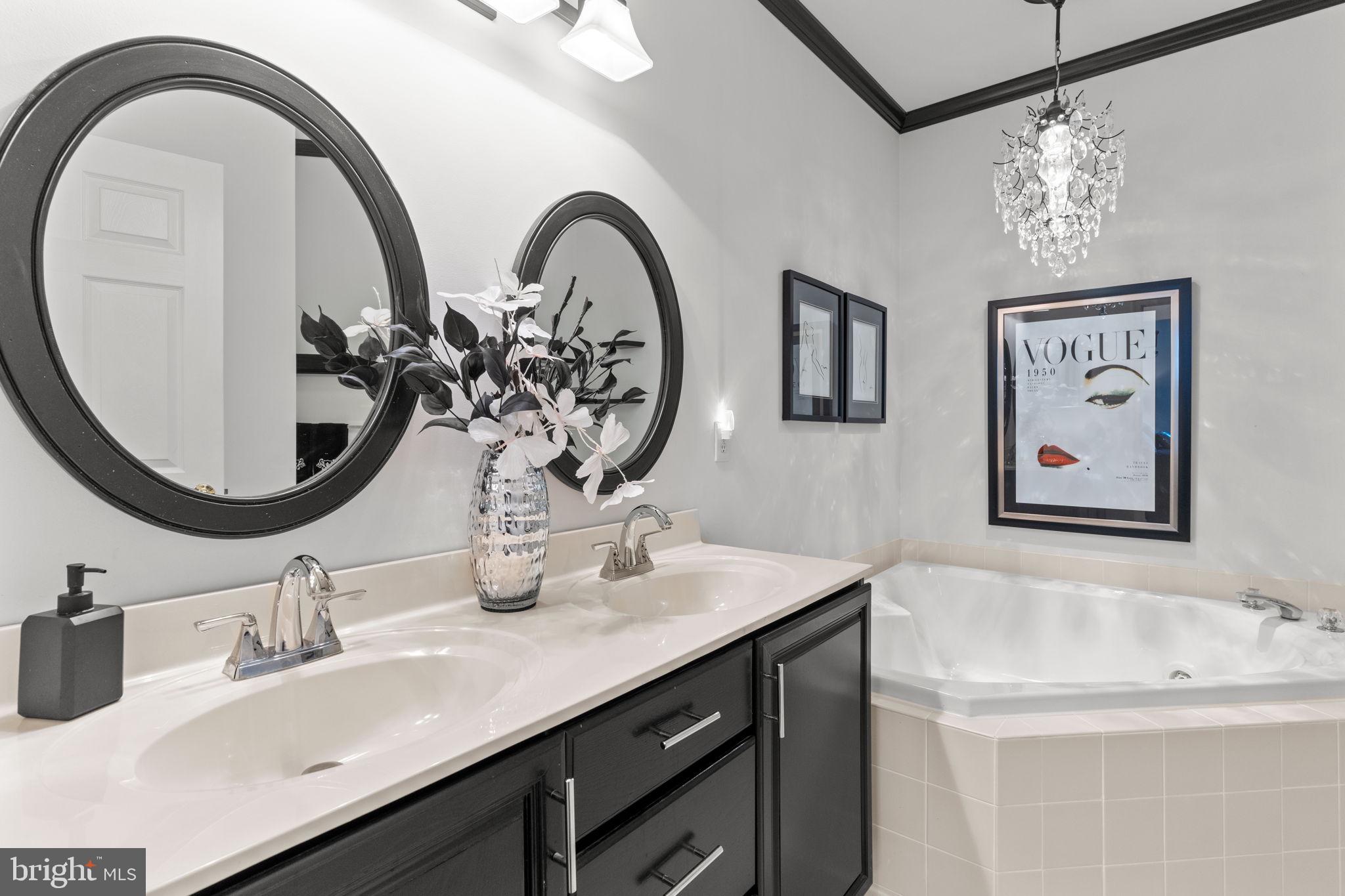 613 Bellflower Road Langhorne, PA 19047 - Photo 19 of 28 a bathroom with a double vanity sink and a mirror
