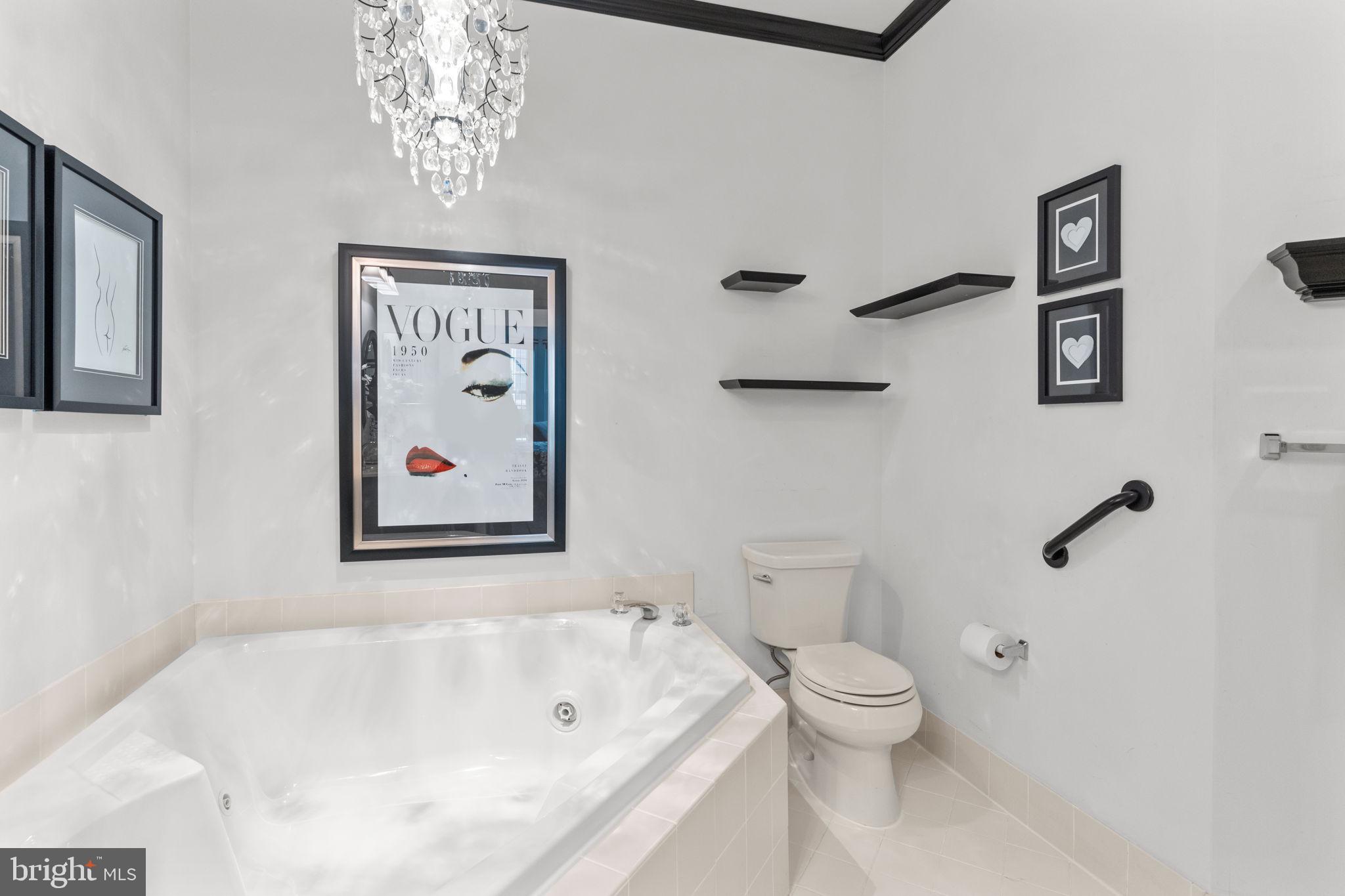 613 Bellflower Road Langhorne, PA 19047 - Photo 20 of 28 a bathroom with a toilet and a bathtub