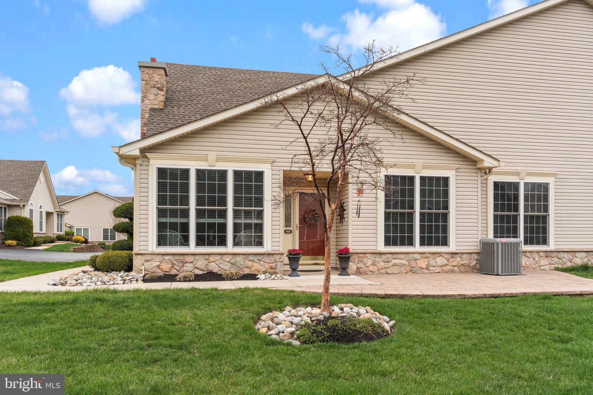 613 Bellflower Road Langhorne, PA 19047 - Photo 2 of 28 a front view of a house with a yard and outdoor seating