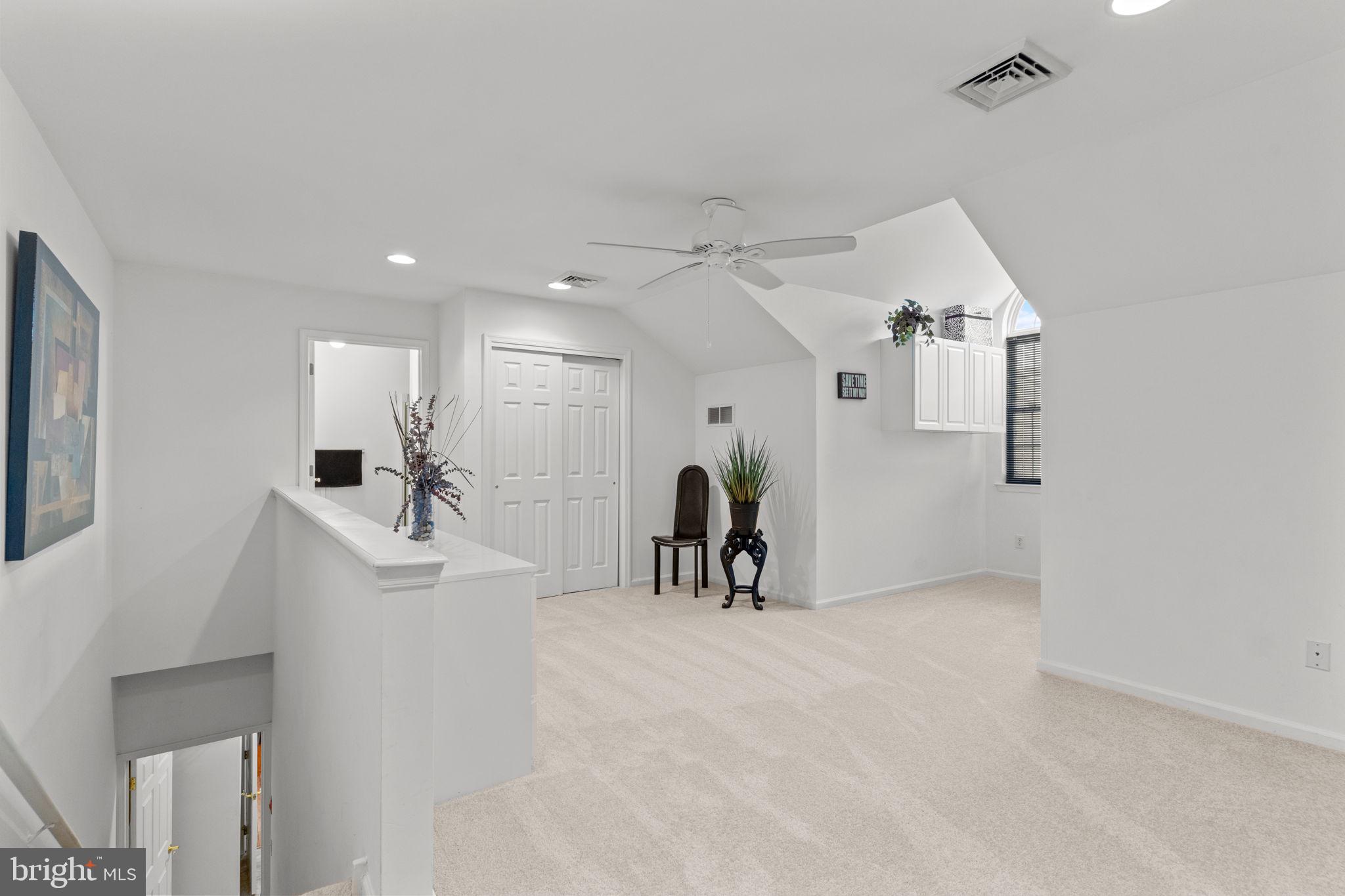 613 Bellflower Road Langhorne, PA 19047 - Photo 25 of 28 a view of a room with gym equipment and a large window