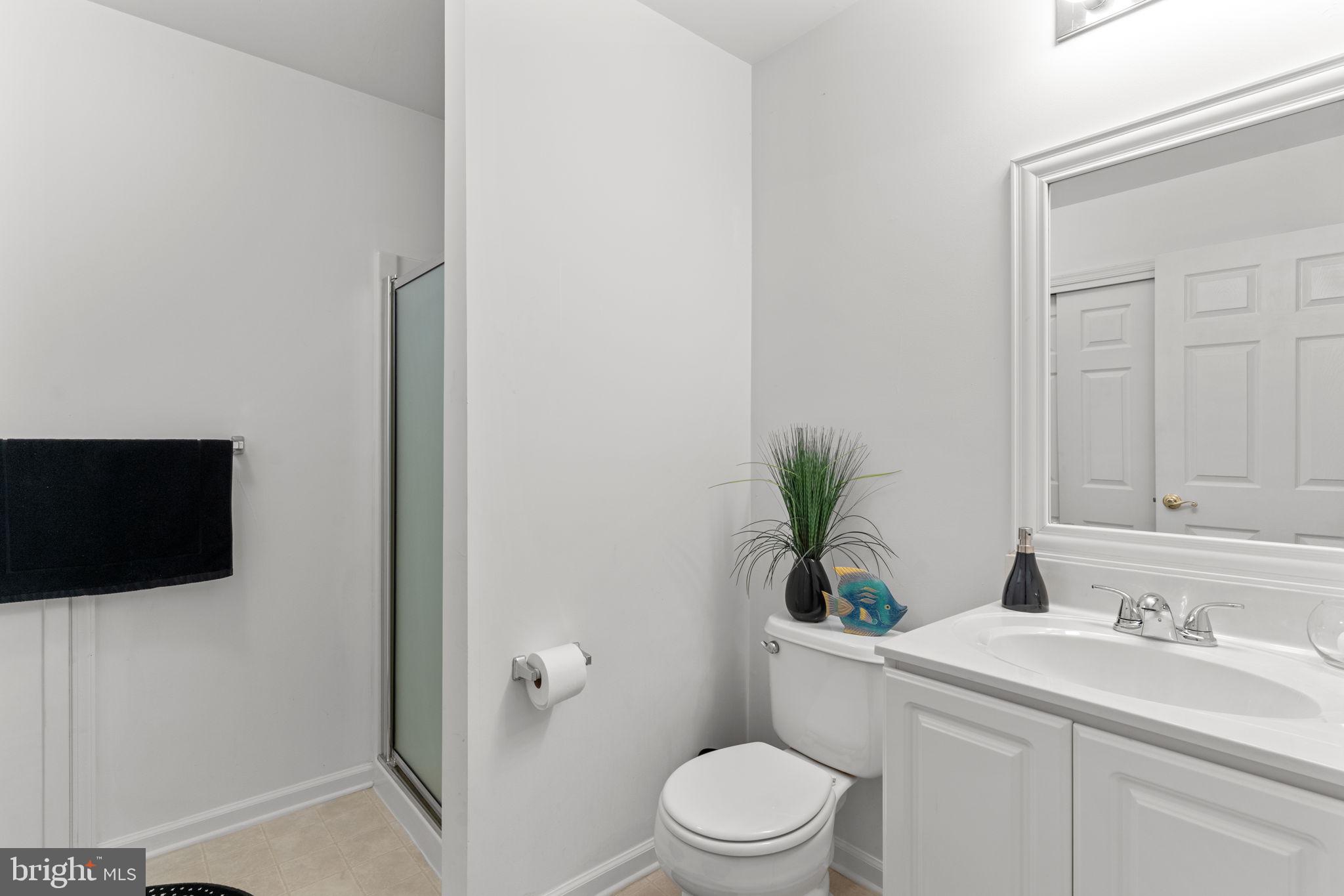 613 Bellflower Road Langhorne, PA 19047 - Photo 27 of 28 a bathroom with a toilet a sink and a bathtub