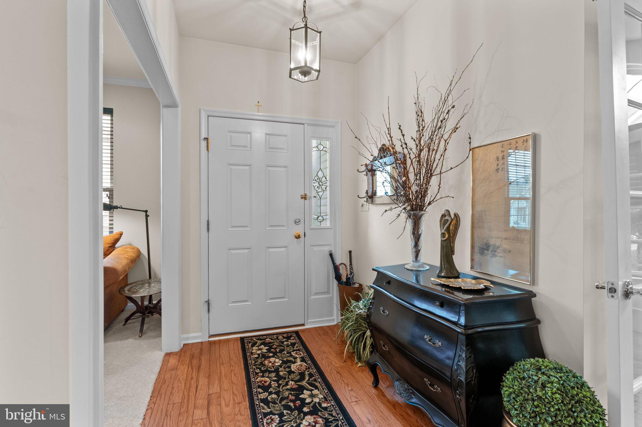 613 Bellflower Road Langhorne, PA 19047 - Photo 4 of 28 a room with furniture and wooden floor