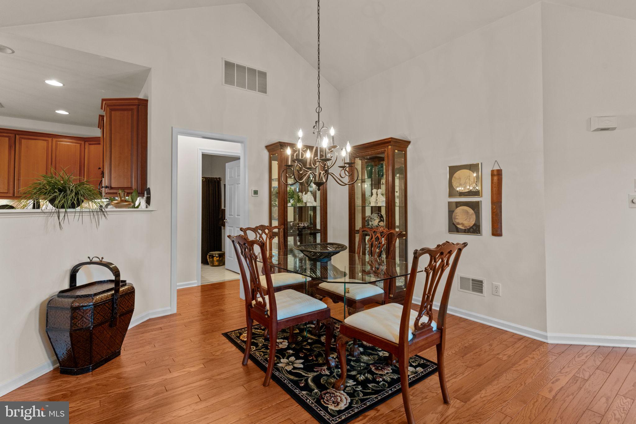 613 Bellflower Road Langhorne, PA 19047 - Photo 8 of 28 a view of a dining room with furniture and wooden floor