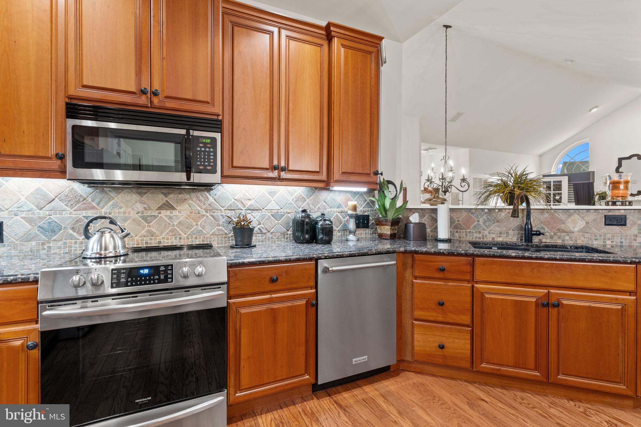 613 Bellflower Road Langhorne, PA 19047 - Photo 10 of 28 a kitchen with granite countertop cabinets stainless steel appliances and a sink