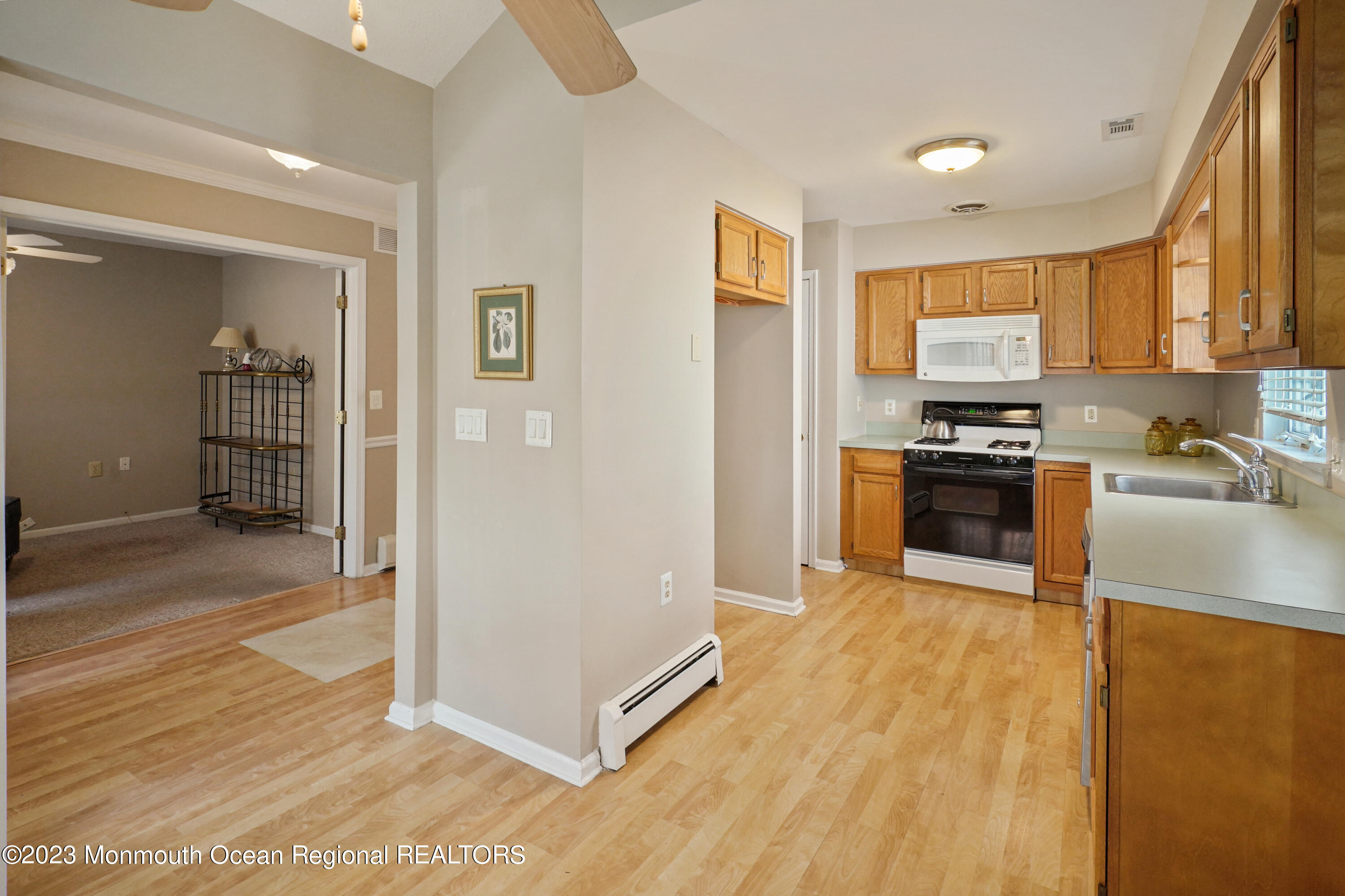7 Portebello Road Jackson, NJ 08527 - Photo 12 of 49 a kitchen with stainless steel appliances granite countertop a refrigerator a sink and a stove