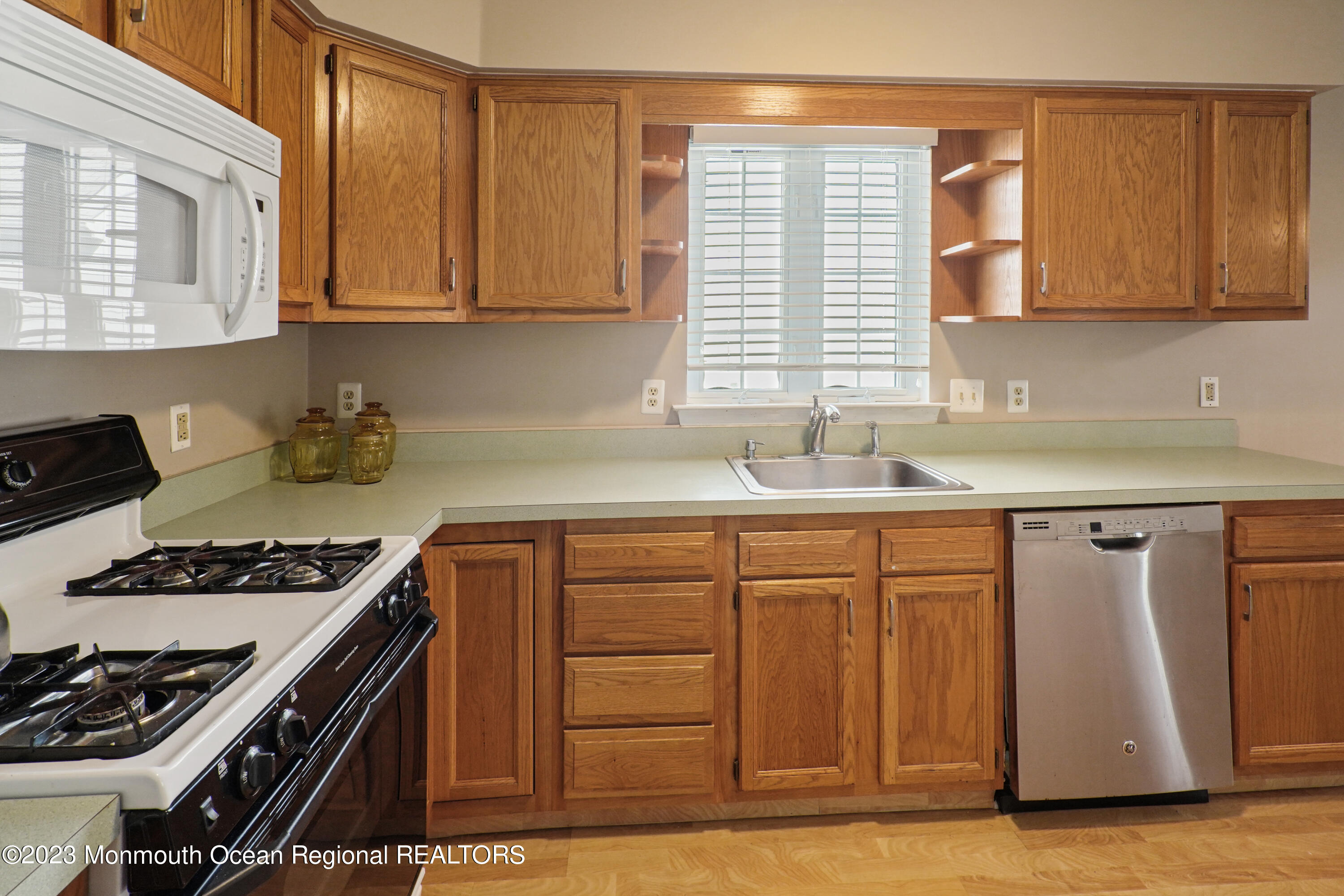 7 Portebello Road Jackson, NJ 08527 - Photo 13 of 49 a kitchen with granite countertop a sink stove and cabinets