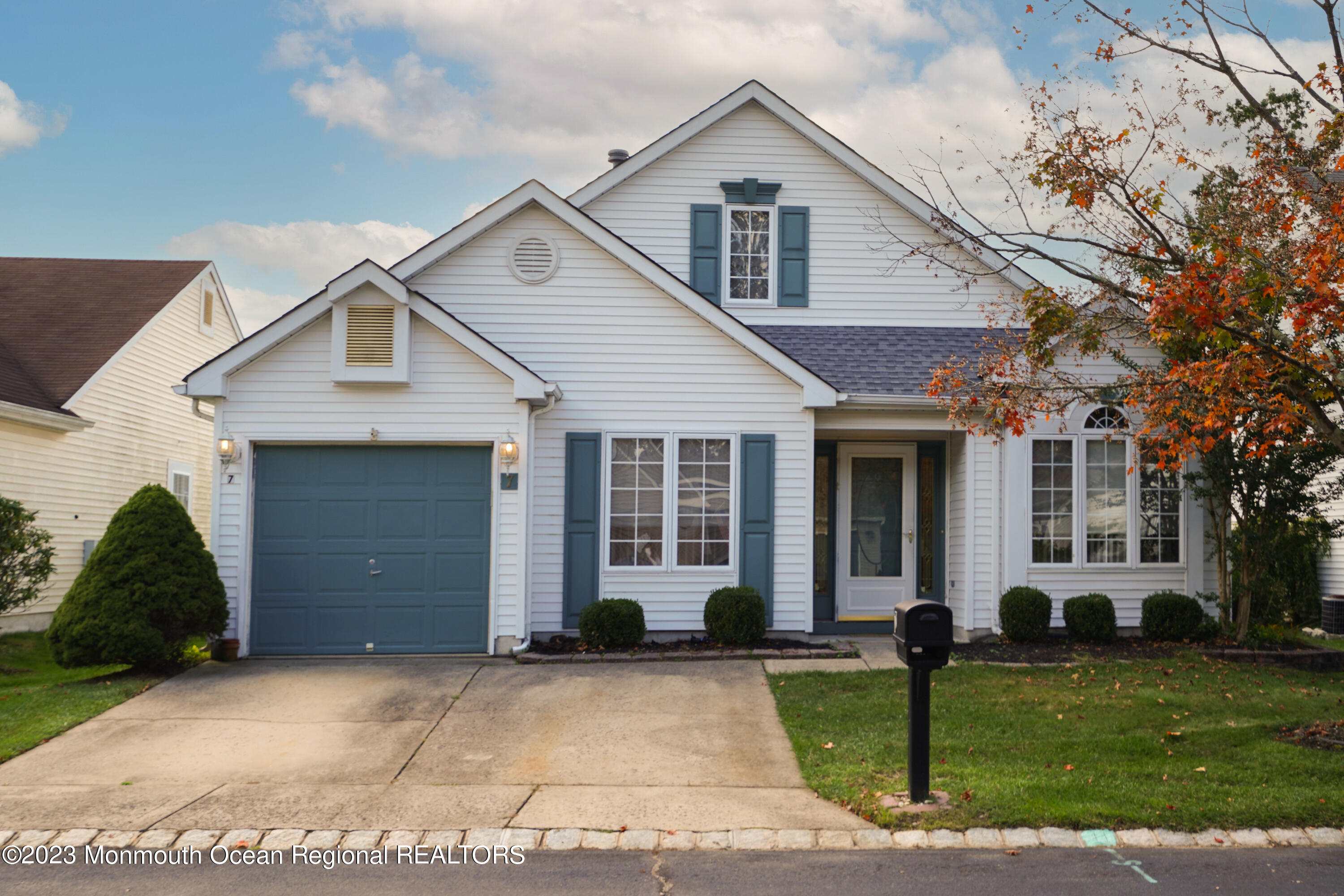 7 Portebello Road Jackson, NJ 08527 - Photo 2 of 49 a front view of a house with a yard and garage