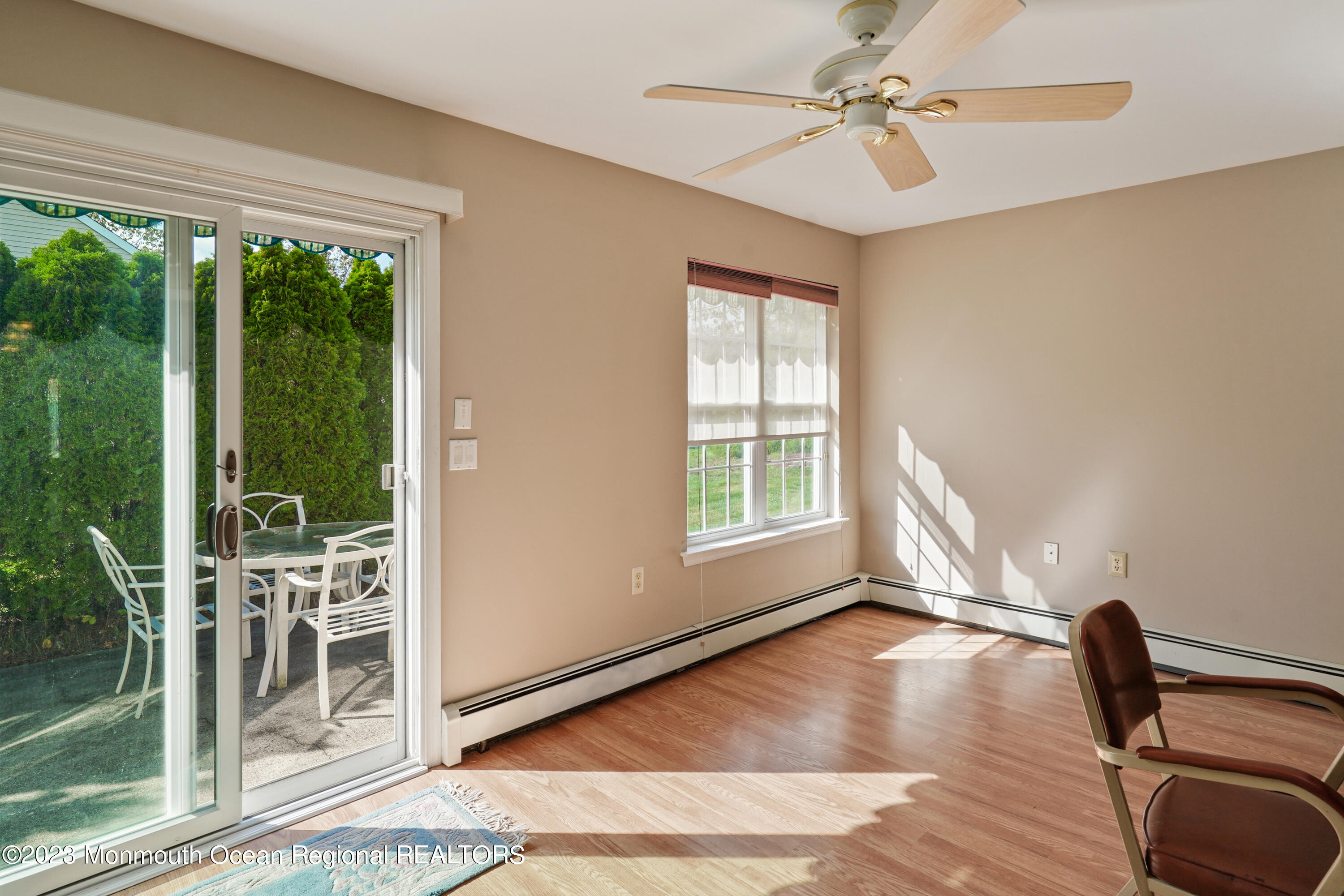 7 Portebello Road Jackson, NJ 08527 - Photo 22 of 49 a view of a livingroom with a dinning area hardwood floor a ceiling fan and windows