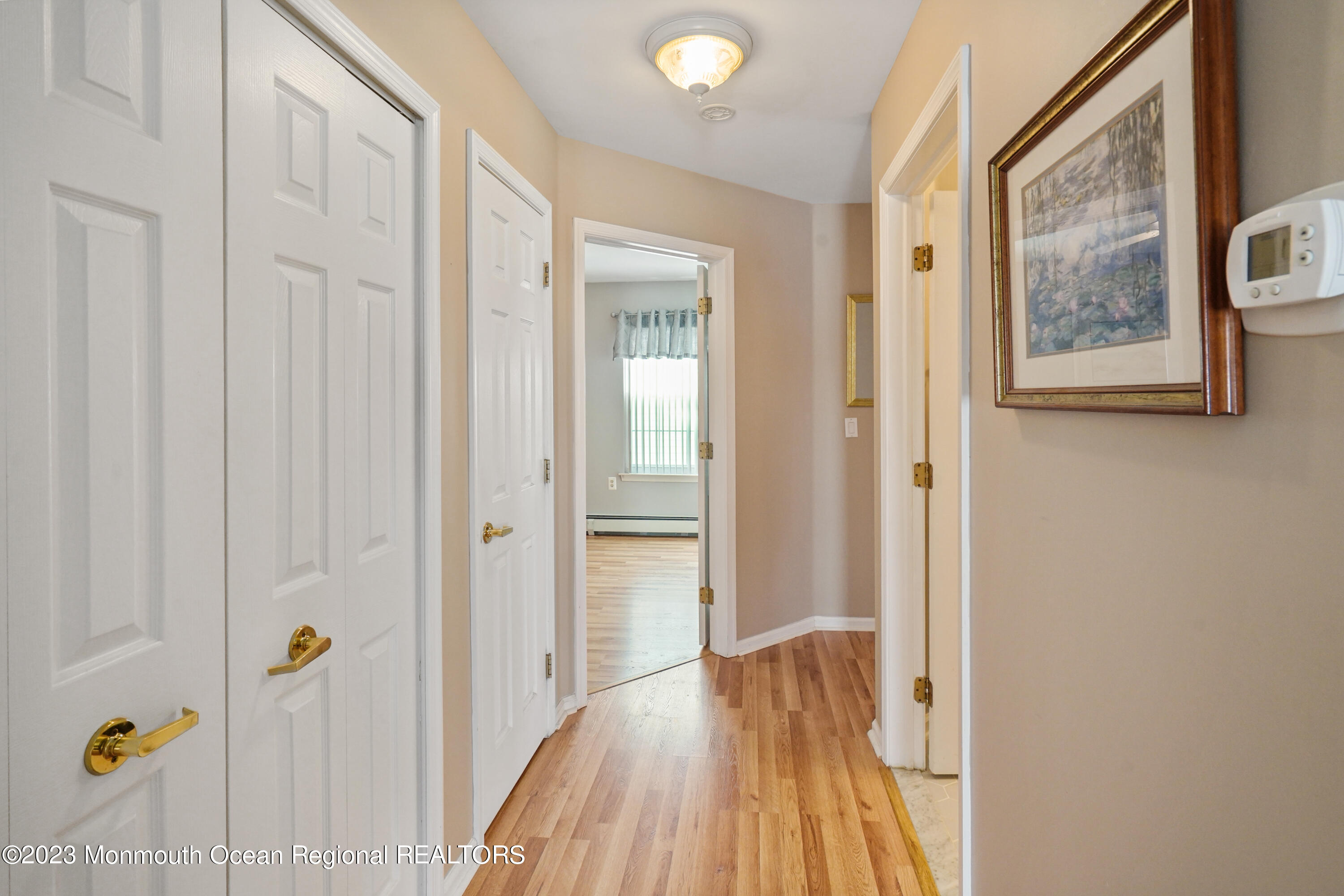 7 Portebello Road Jackson, NJ 08527 - Photo 24 of 49 a view of a hallway with wooden floor and staircase