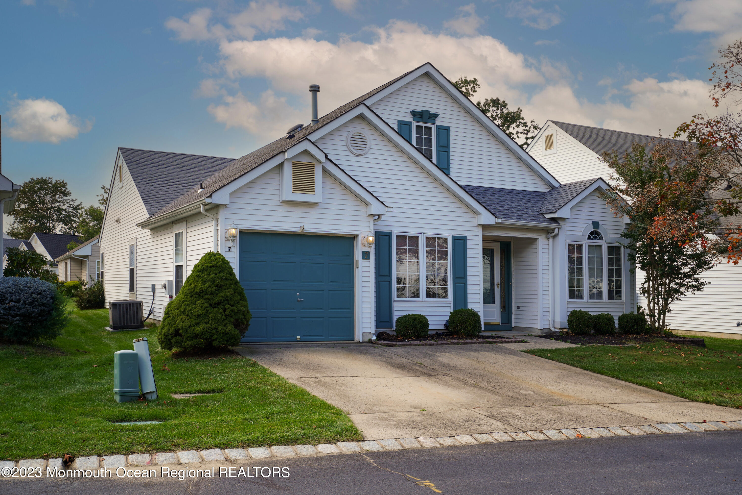 7 Portebello Road Jackson, NJ 08527 - Photo 3 of 49 a front view of a house with a garden and plants