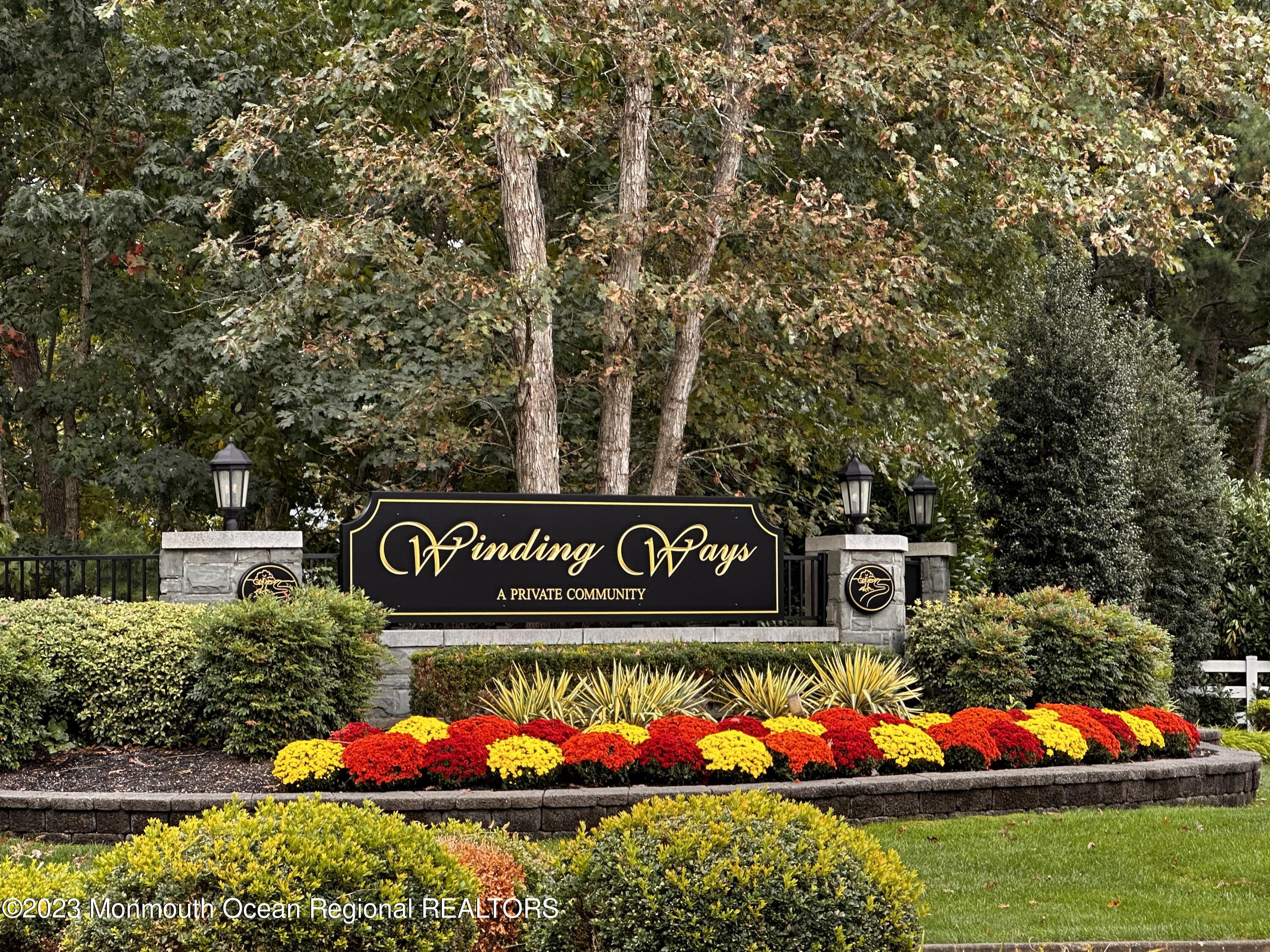 7 Portebello Road Jackson, NJ 08527 - Photo 49 of 49 a street sign that is sitting on a small yard