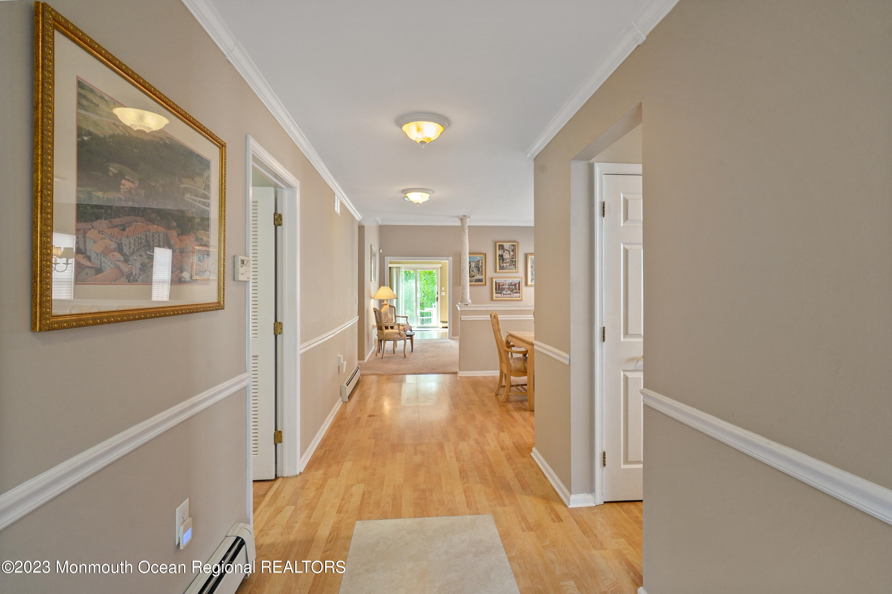 7 Portebello Road Jackson, NJ 08527 - Photo 5 of 49 a view of a hallway with wooden floor and a living room
